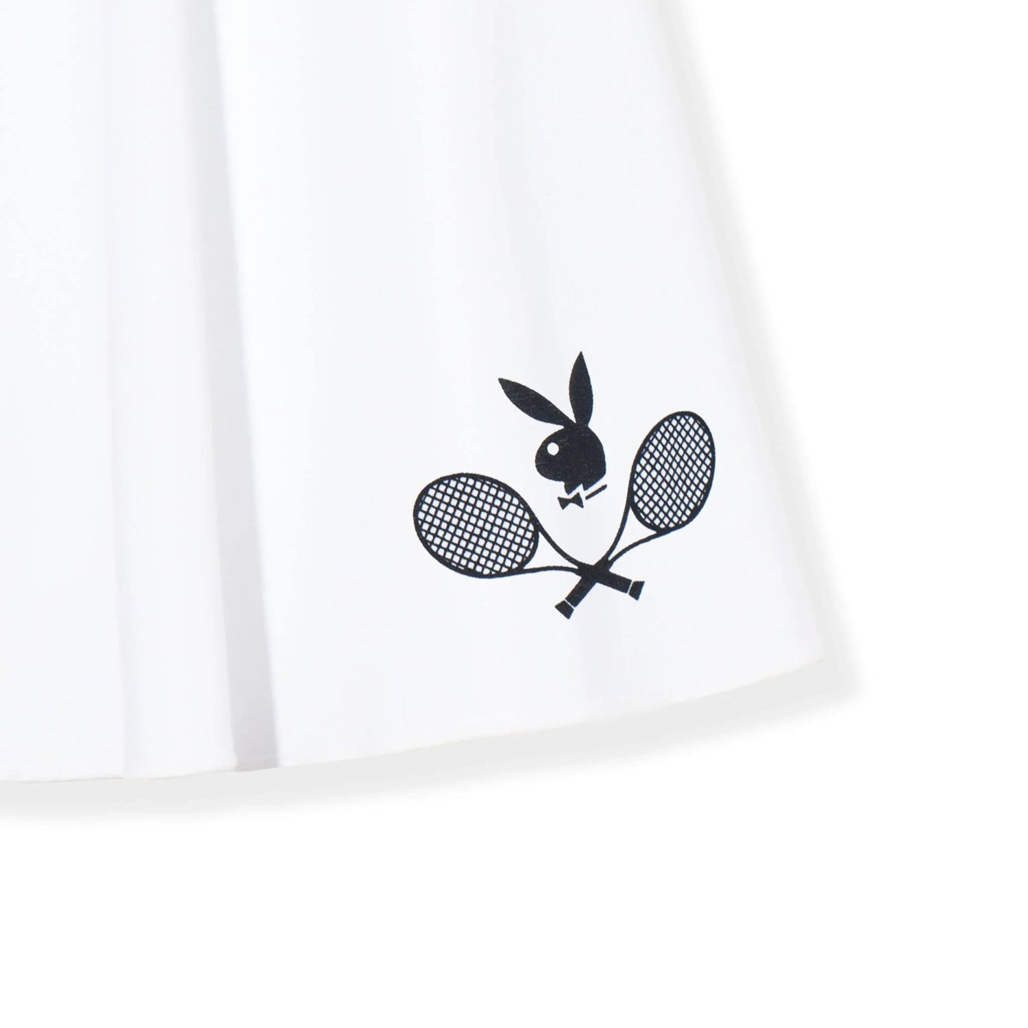 White tennis club skirt with black graphic of crossed tennis rackets and a bunny head logo