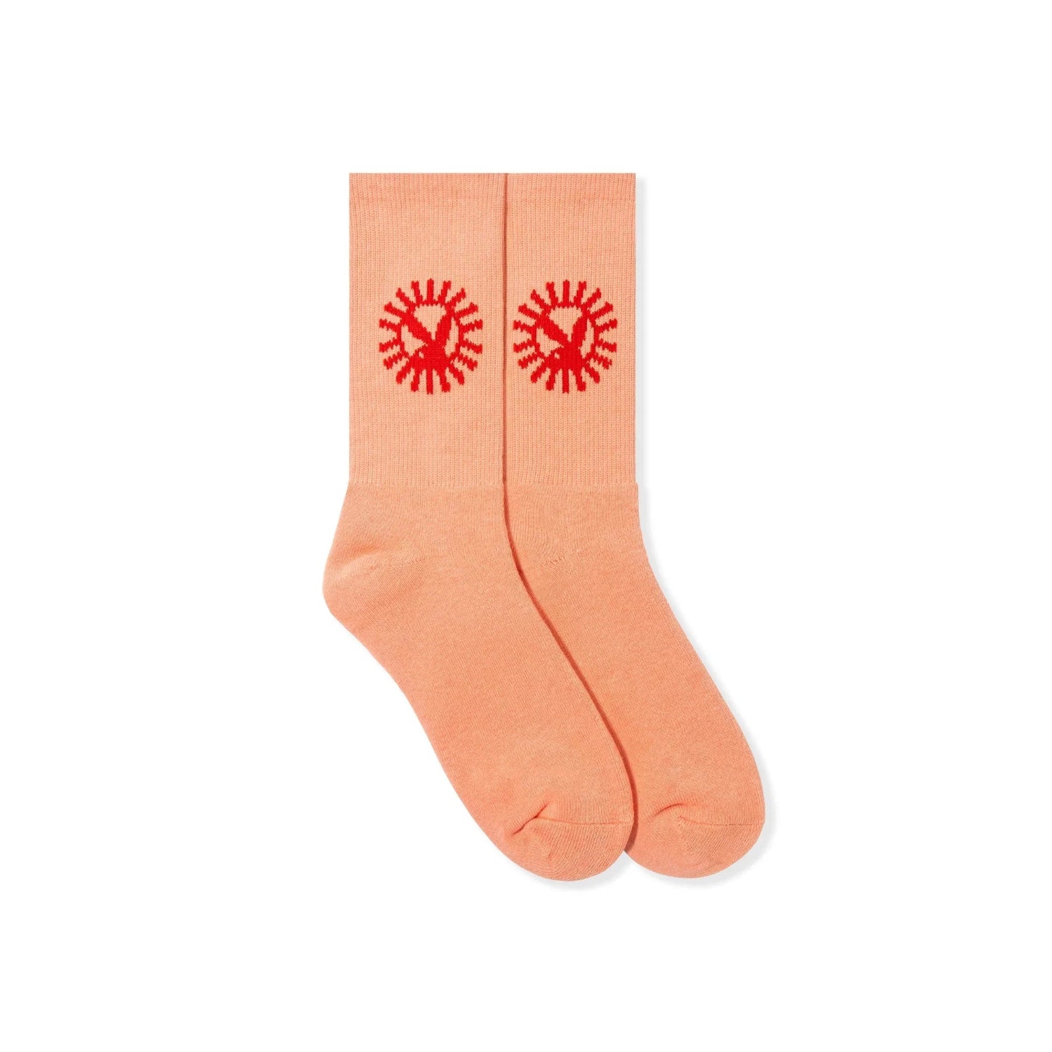 Peach crew socks with red bunny and sunburst design, laid flat on white background