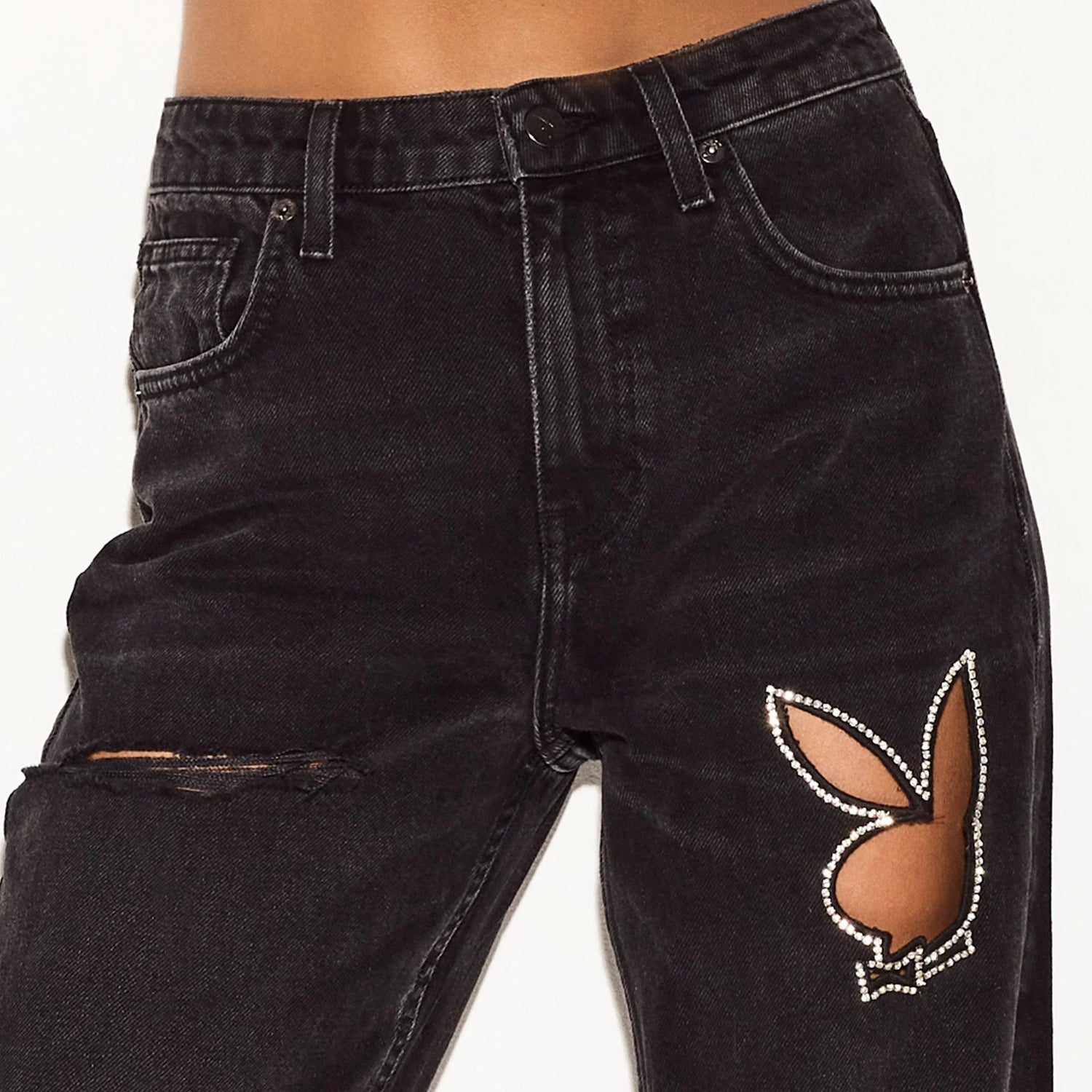 High-rise black wide-leg jeans with rhinestone bunny cutout and distressed knee detail