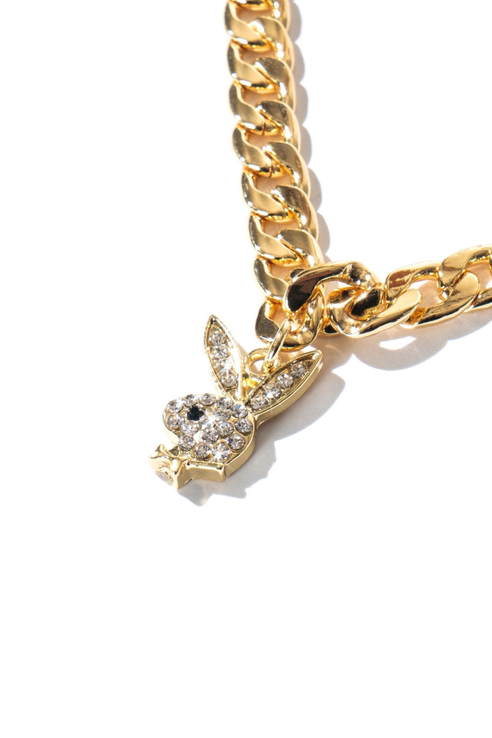 Gold chain choker with crystal-studded rabbit head pendant on white background