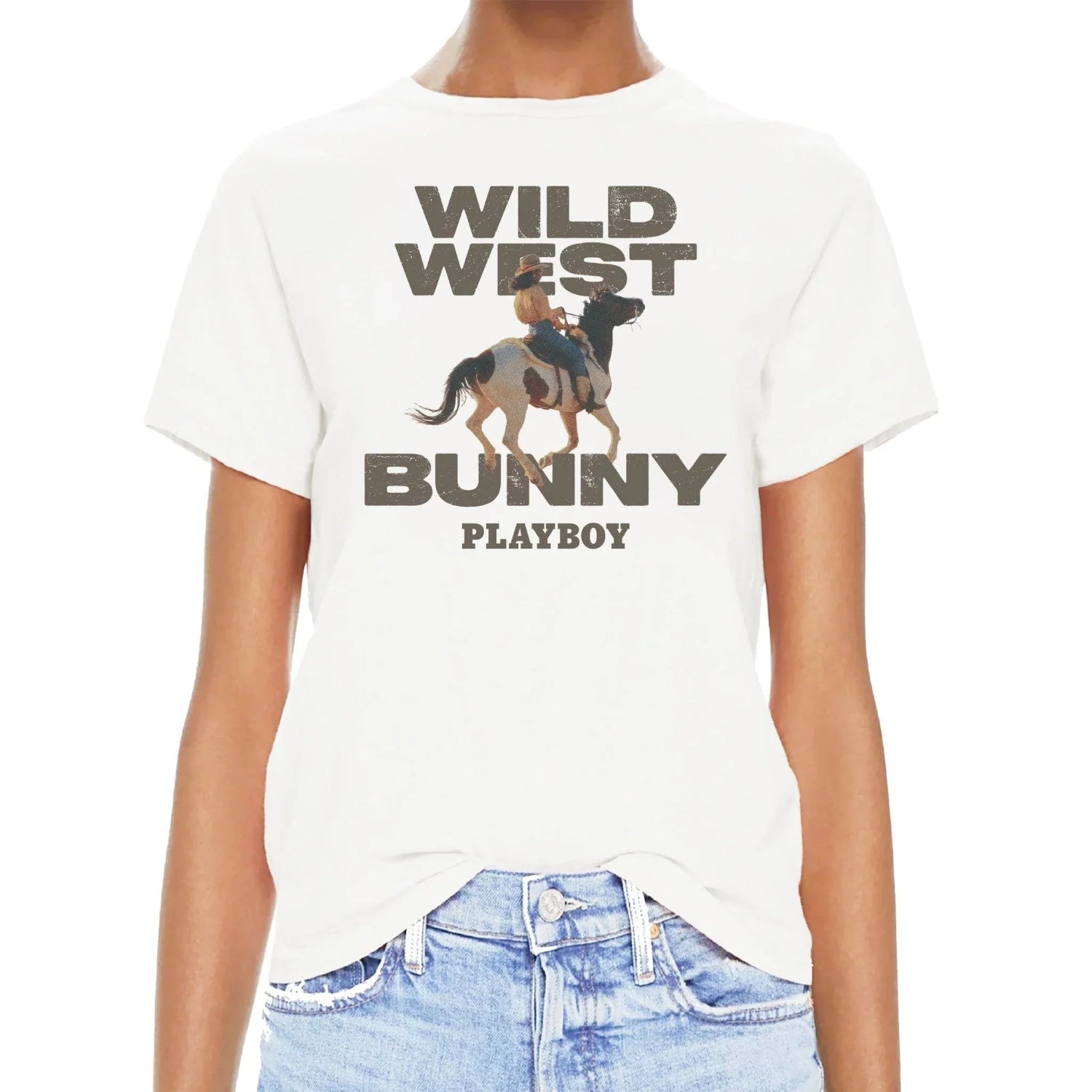 White t-shirt with Wild West Bunny graphic and woman riding a horse, paired with denim jeans.