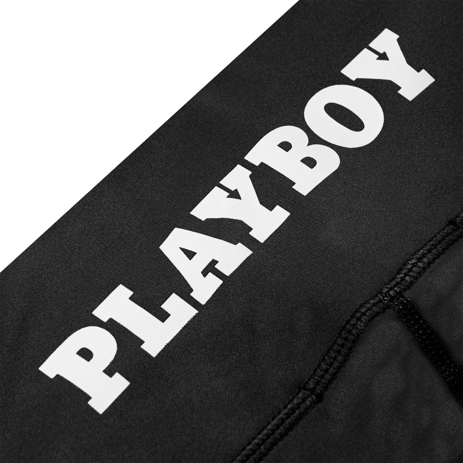 Black bike shorts with bold white PLAYBOY text and visible seam detail