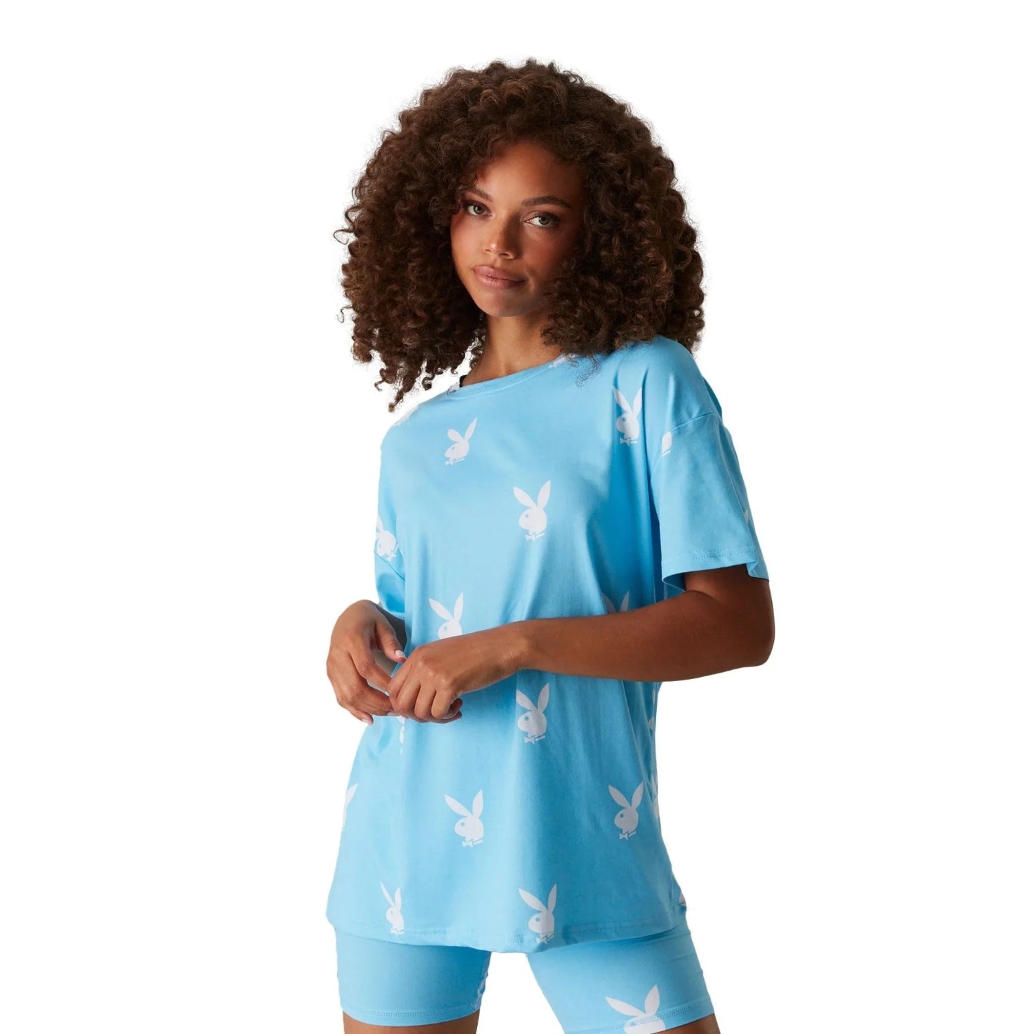 Woman wearing light blue t-shirt with white bunny print and matching shorts set