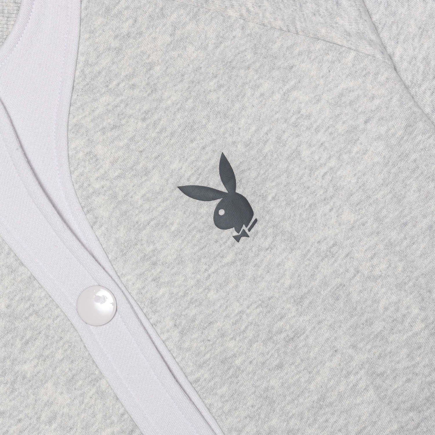 Light grey women's bomber jacket with bunny logo and white button detail