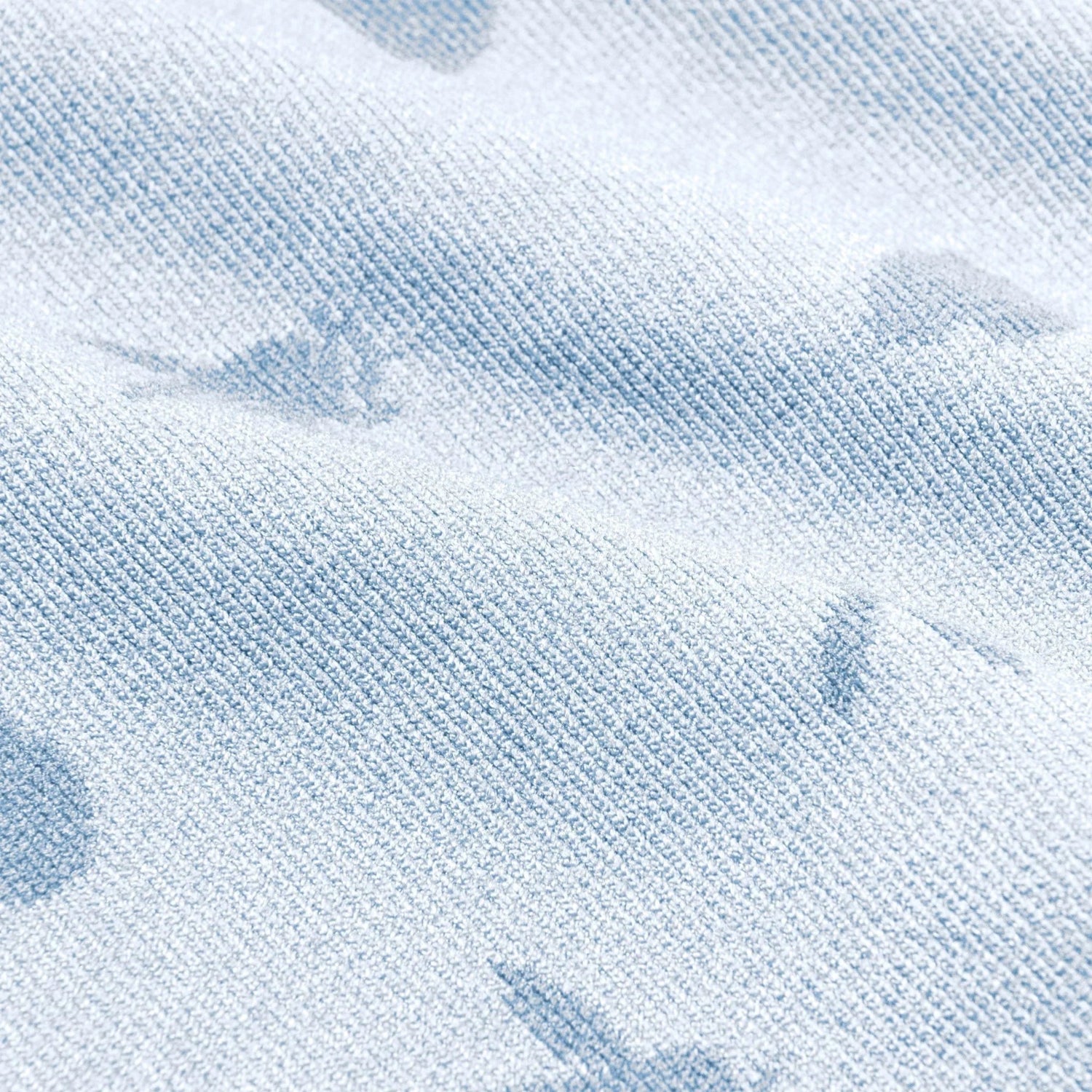 Light blue seamless cami fabric with textured bunny patterns, close-up view