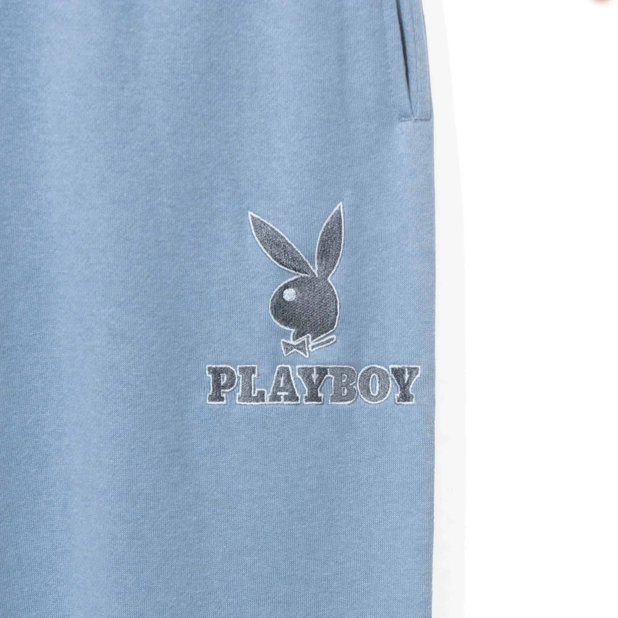 Light blue women's boyfriend sweatpants with pocket and bunny logo text graphic