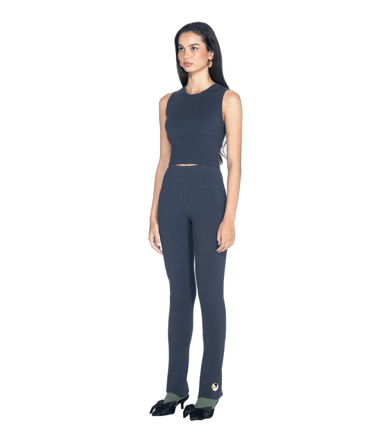 Woman wearing dark gray ribbed cropped tank top and matching high-waisted ribbed pants