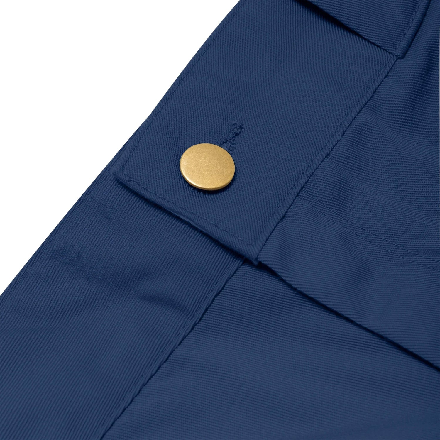Close-up of blue women's work pants with a gold button detail