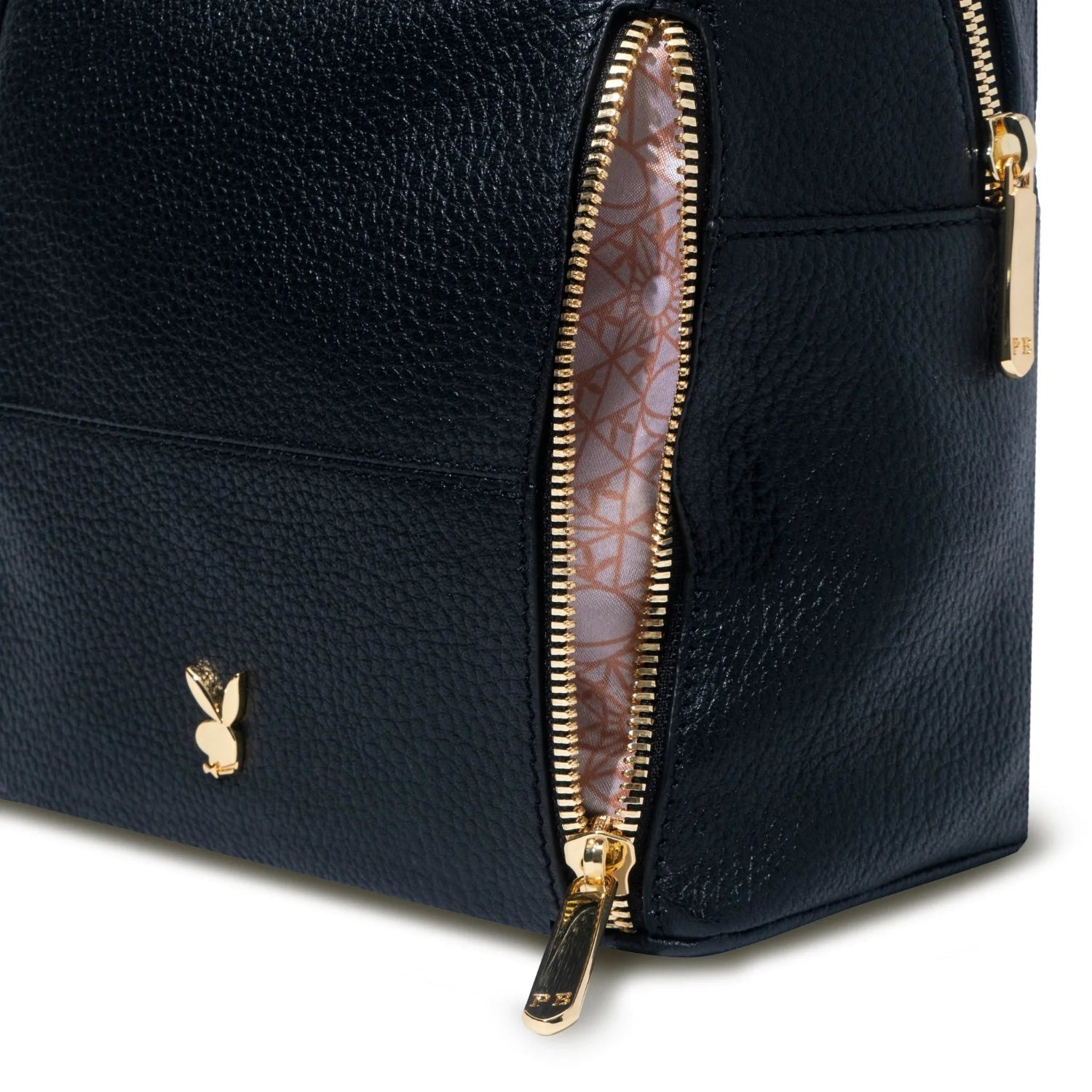 Black leather mini backpack with gold zipper details and patterned interior lining