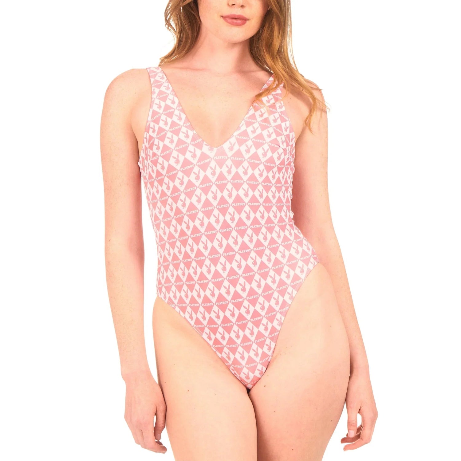 Woman wearing pink one-piece monogram swimsuit with geometric white pattern