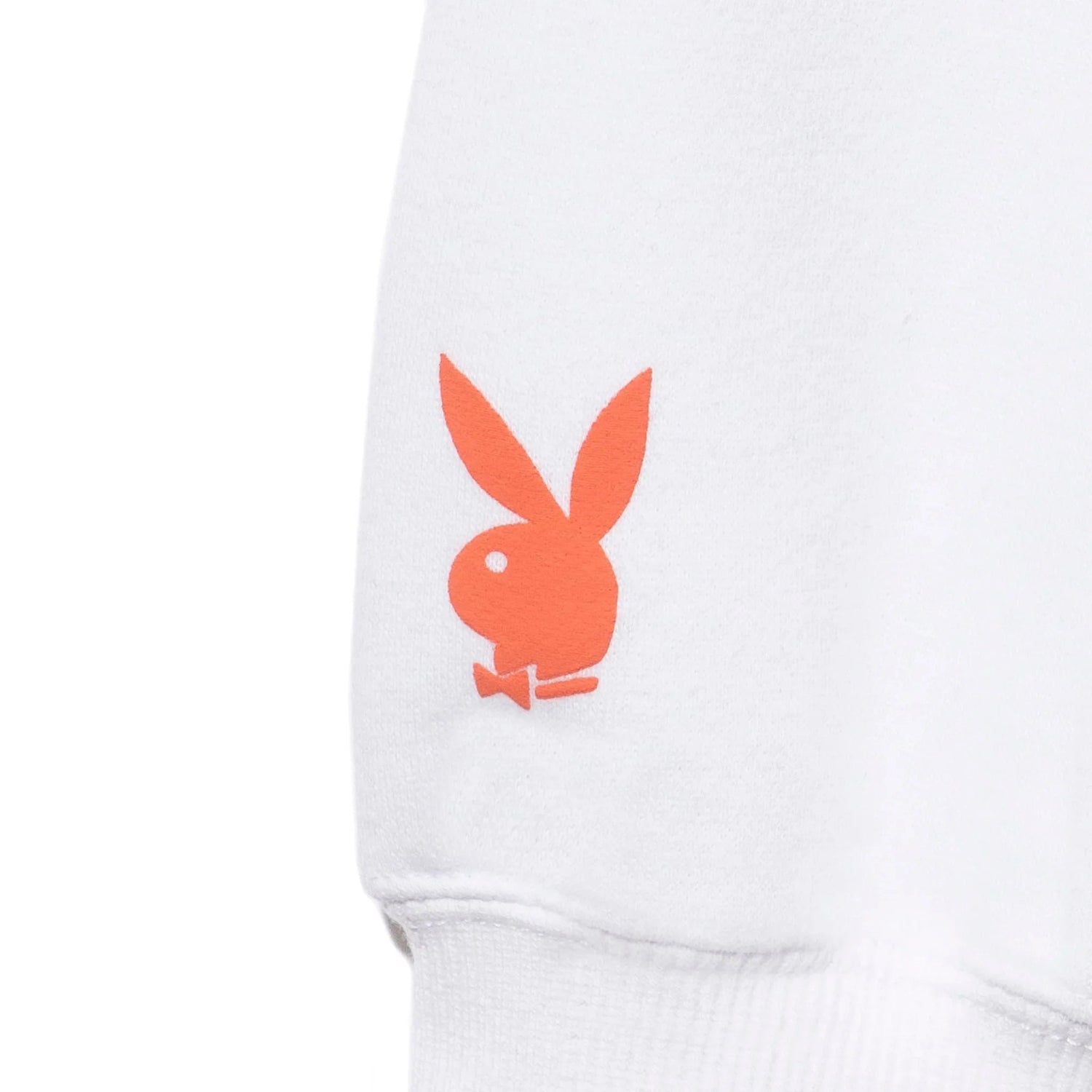 White crewneck sweatshirt with orange bunny logo on sleeve, women's casual clothing