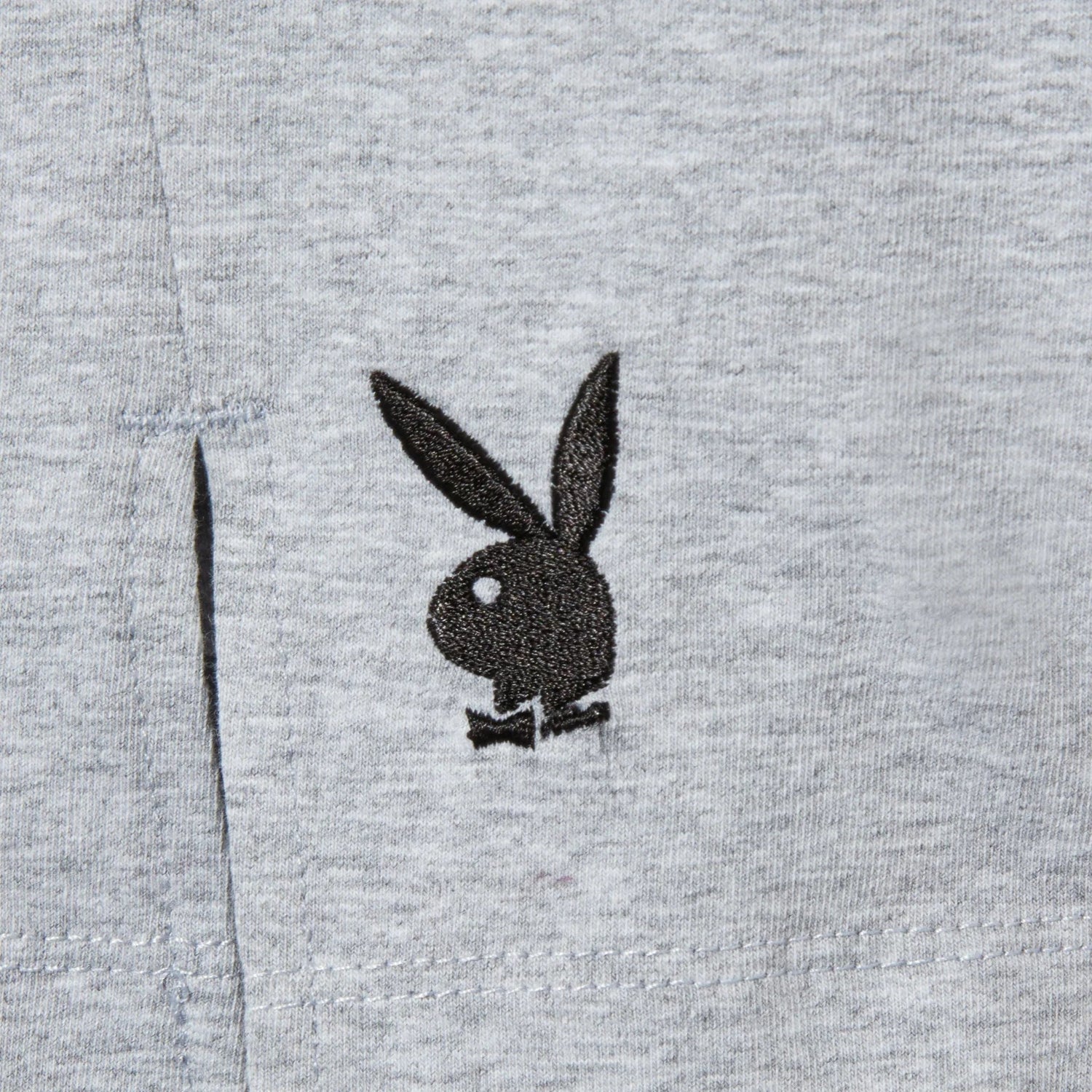 Gray women’s slit skirt with black bunny logo embroidered near the front slit