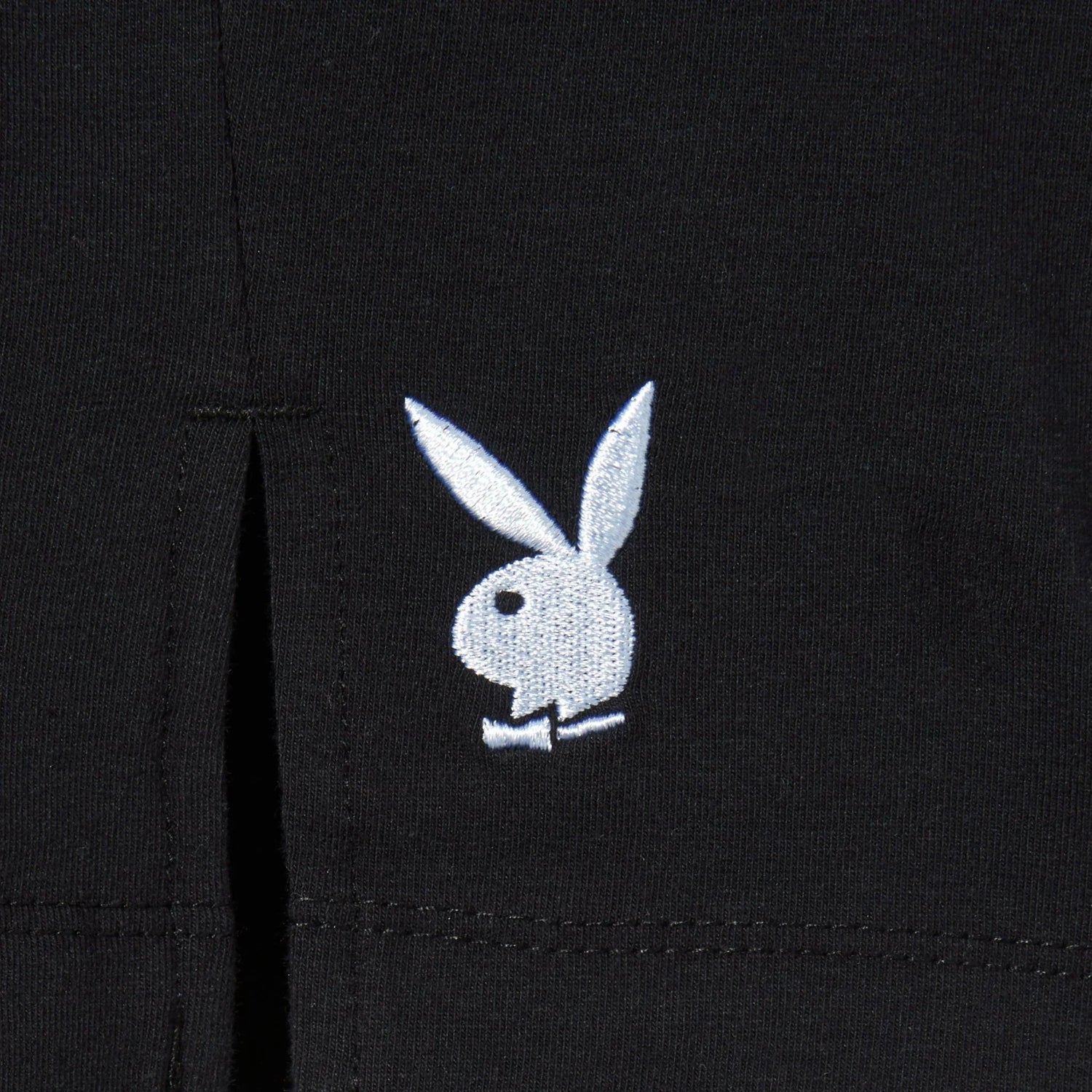 Black women's slit skirt with white rabbit head logo embroidery near the front slit