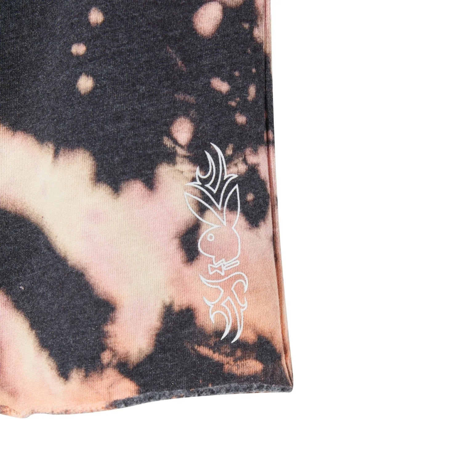 Close-up of women's tie-dye grunge sweatshort leg with bunny graphic detail