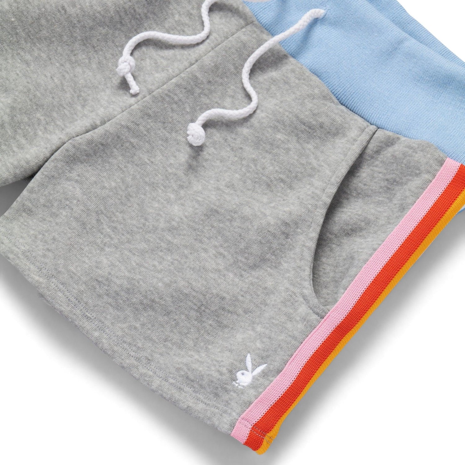 Gray women’s warmup shorts with light blue waistband, pink and orange stripes, and white logo.