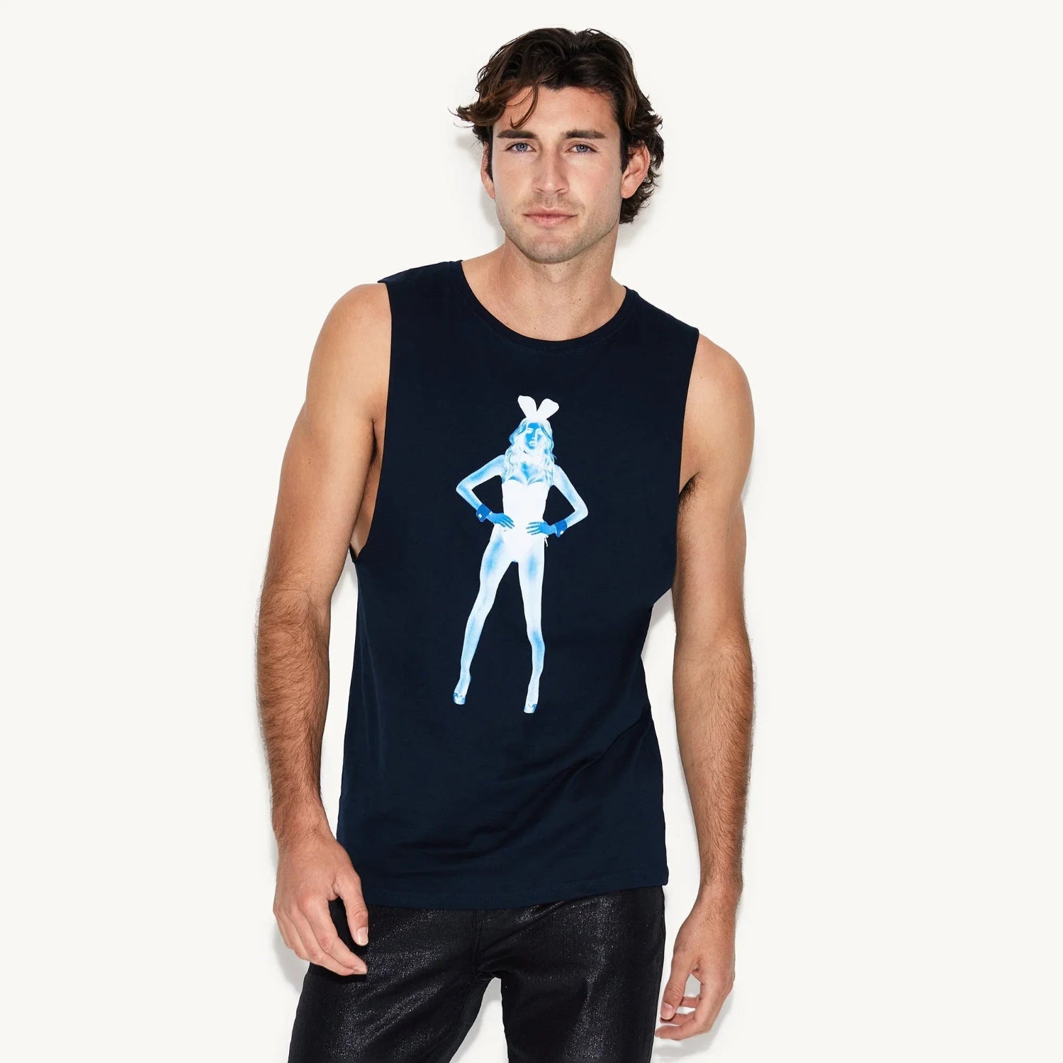 Man wearing black muscle tank top with blue x-ray style bunny graphic, casual fashion