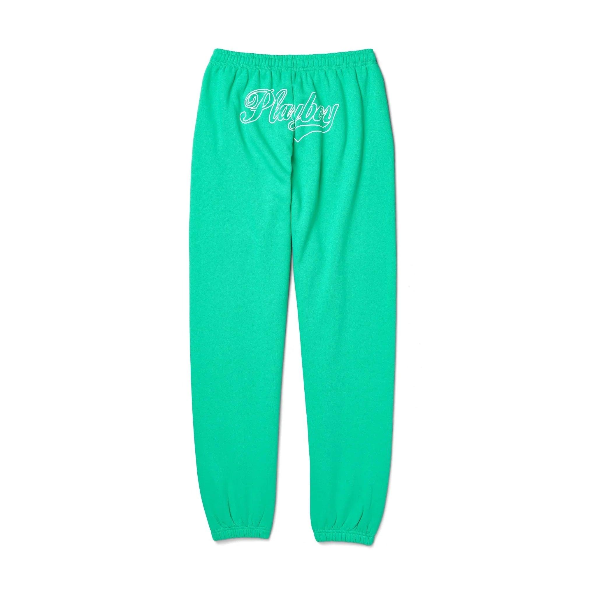 Green women's sweatpants with elastic waistband, white script logo on back, isolated on white