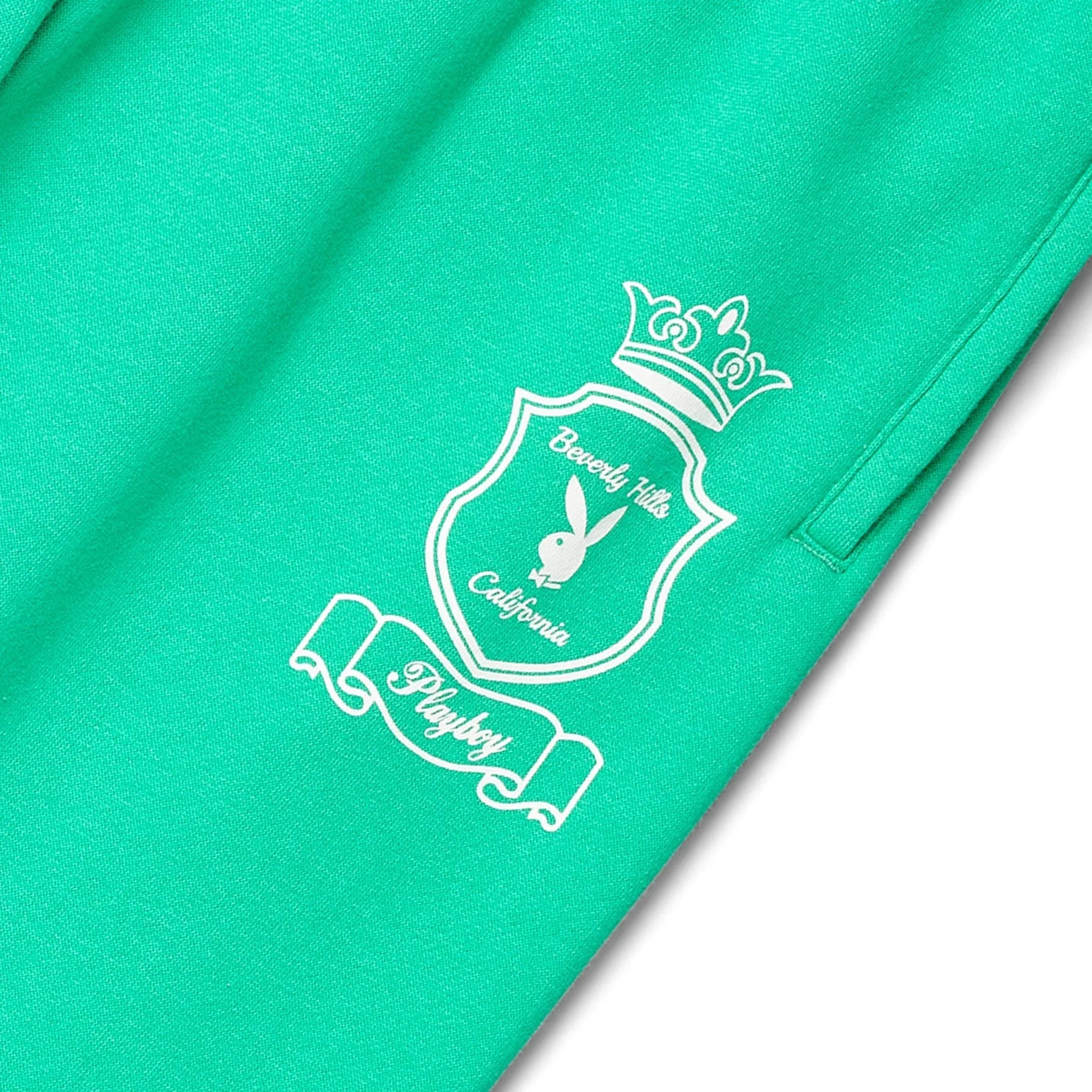 Green women's sweatpants with Beverly Hills California crest and rabbit logo graphic on leg
