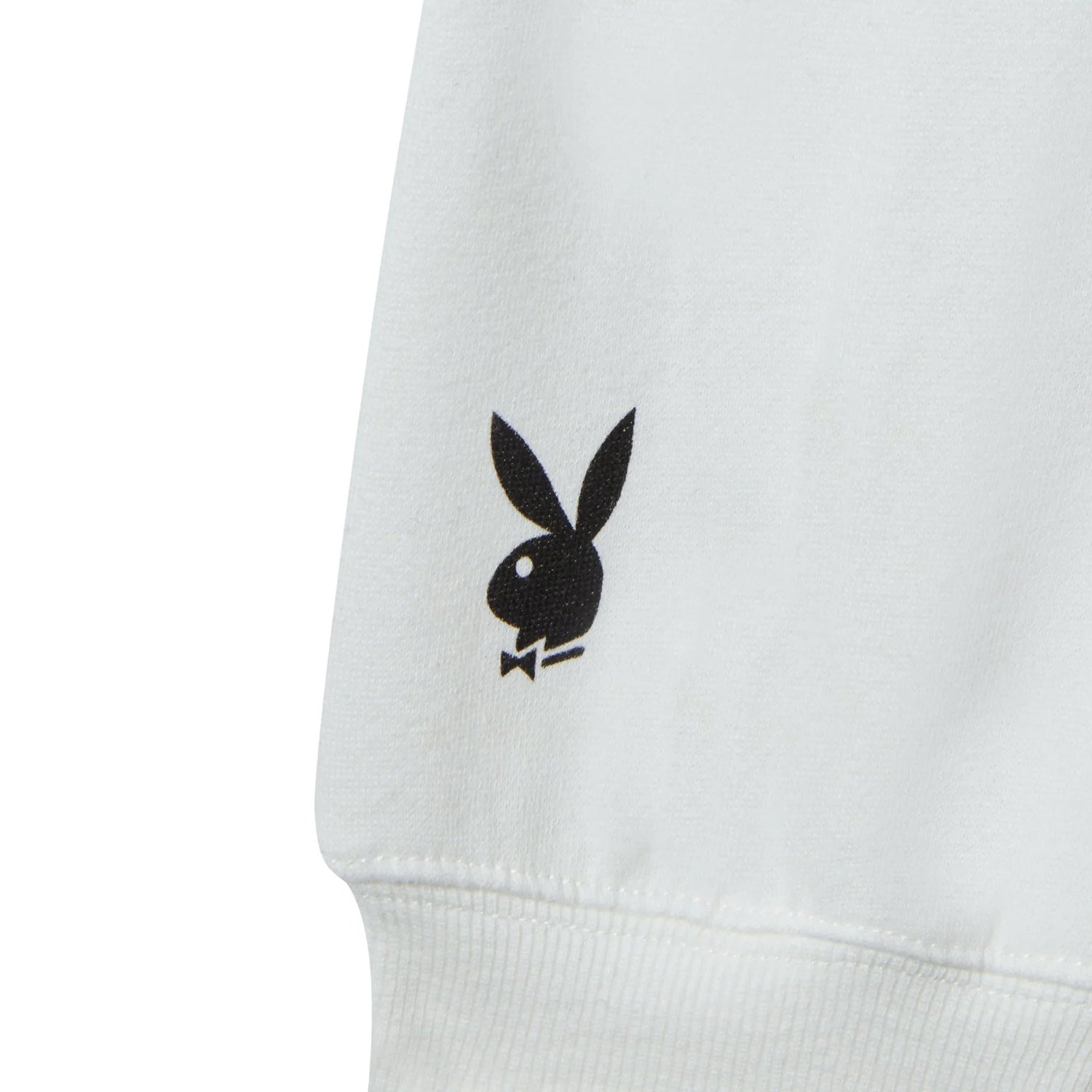 Close-up of white women's crewneck sweatshirt with black bunny logo print