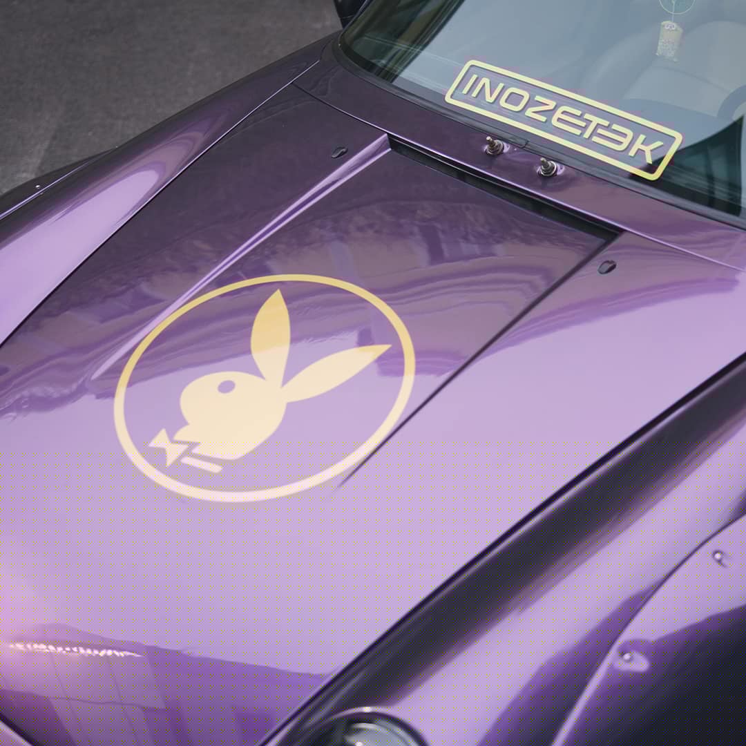 Purple sports car hood with gold bunny logo and glossy finish, INOZETEK windshield banner