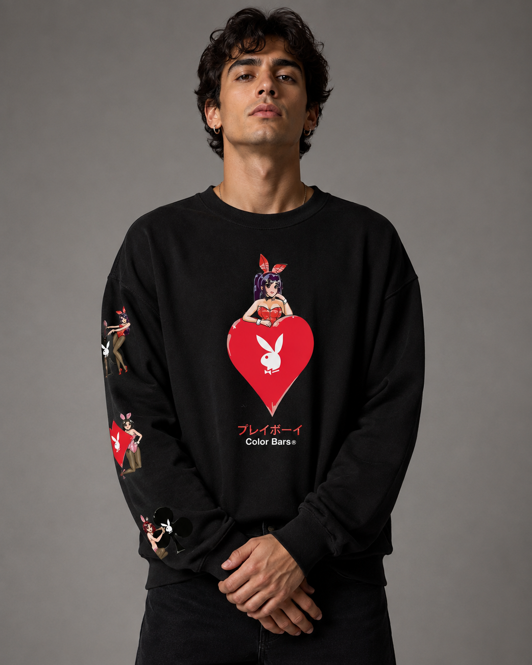 A man wearing a black long-sleeve sweatshirt with a red heart and bunny graphic on the front, posed against a solid gray studio background. #Streetwearmen