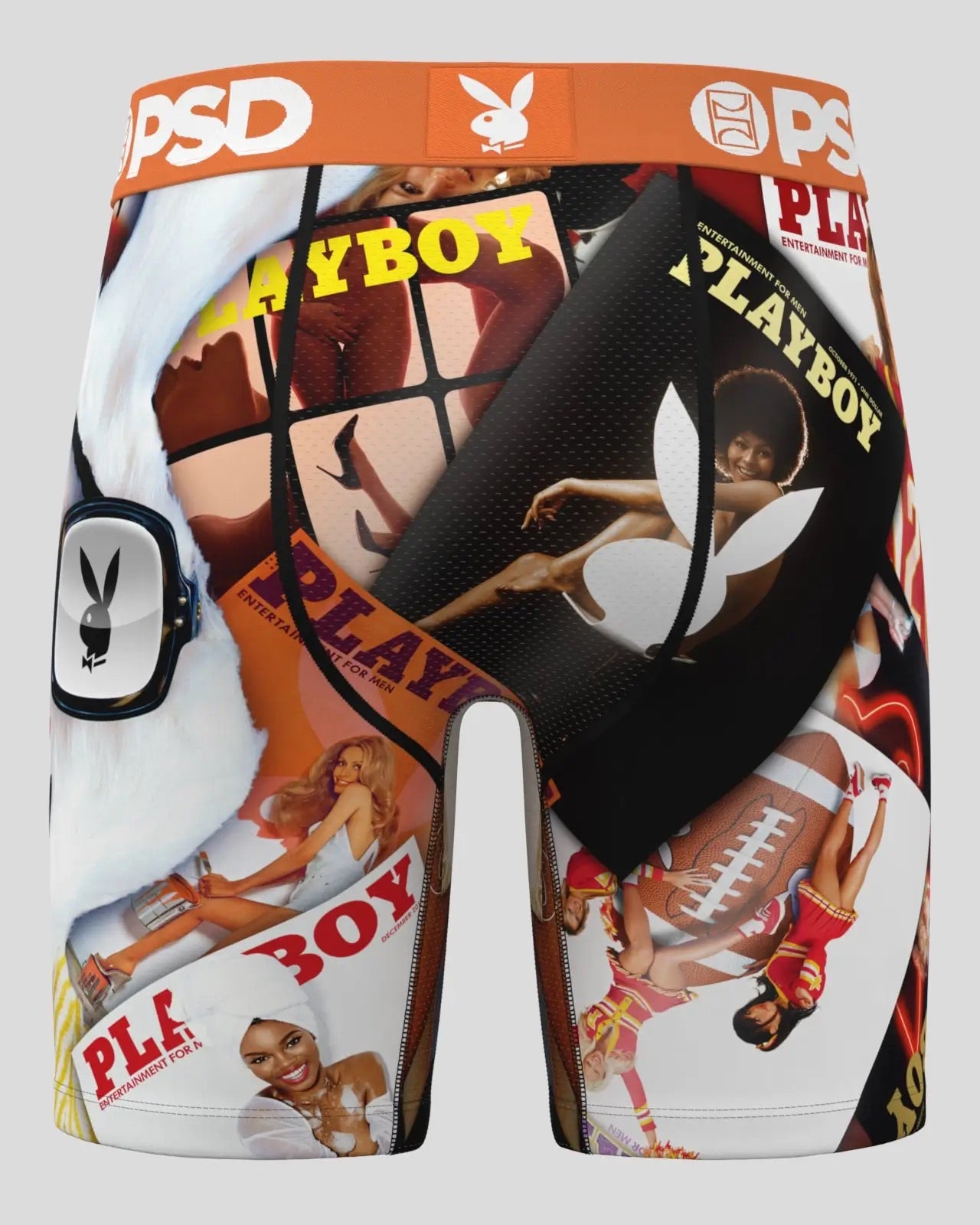 A pair of boxer briefs featuring a collage print of classic Playboy magazine covers and advertisements, with an orange waistband displaying the Playboy bunny logo and 'PSD' branding.