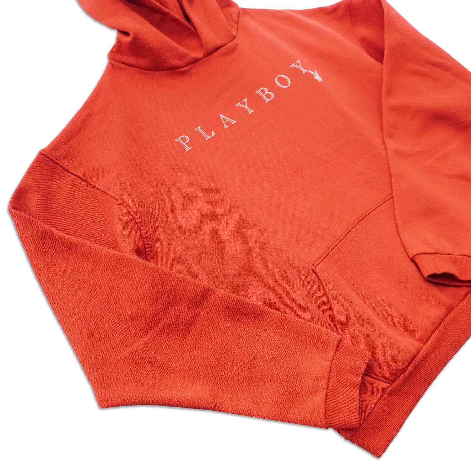 Red hooded sweatshirt with white PLAYBOY text and front pocket, laid flat