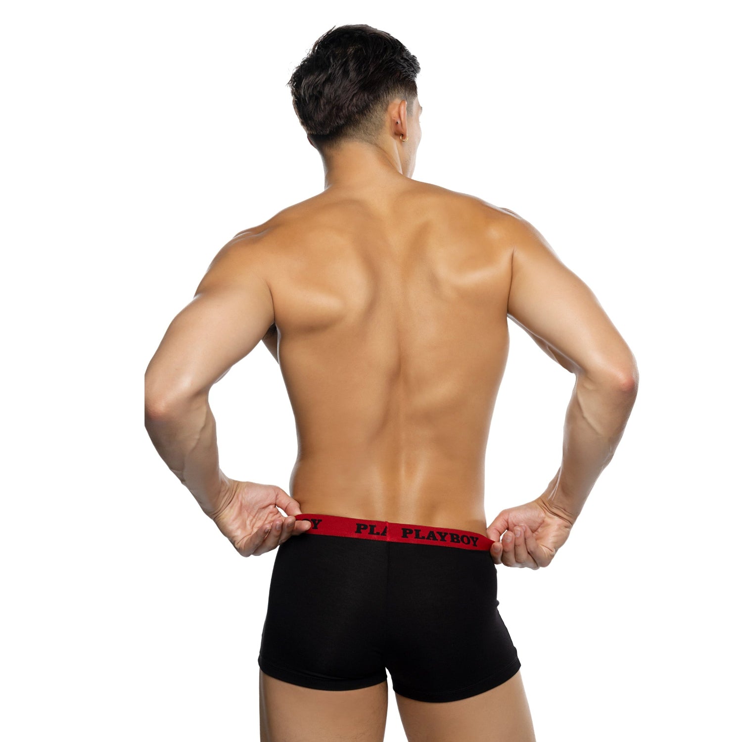 Man modeling black boxer briefs with red waistband and PLAYBOY text, back view