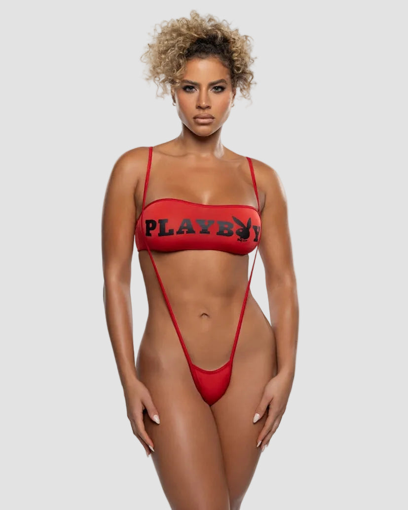 Woman modeling red monokini with bold black graphic text and scoop neckline on white background
