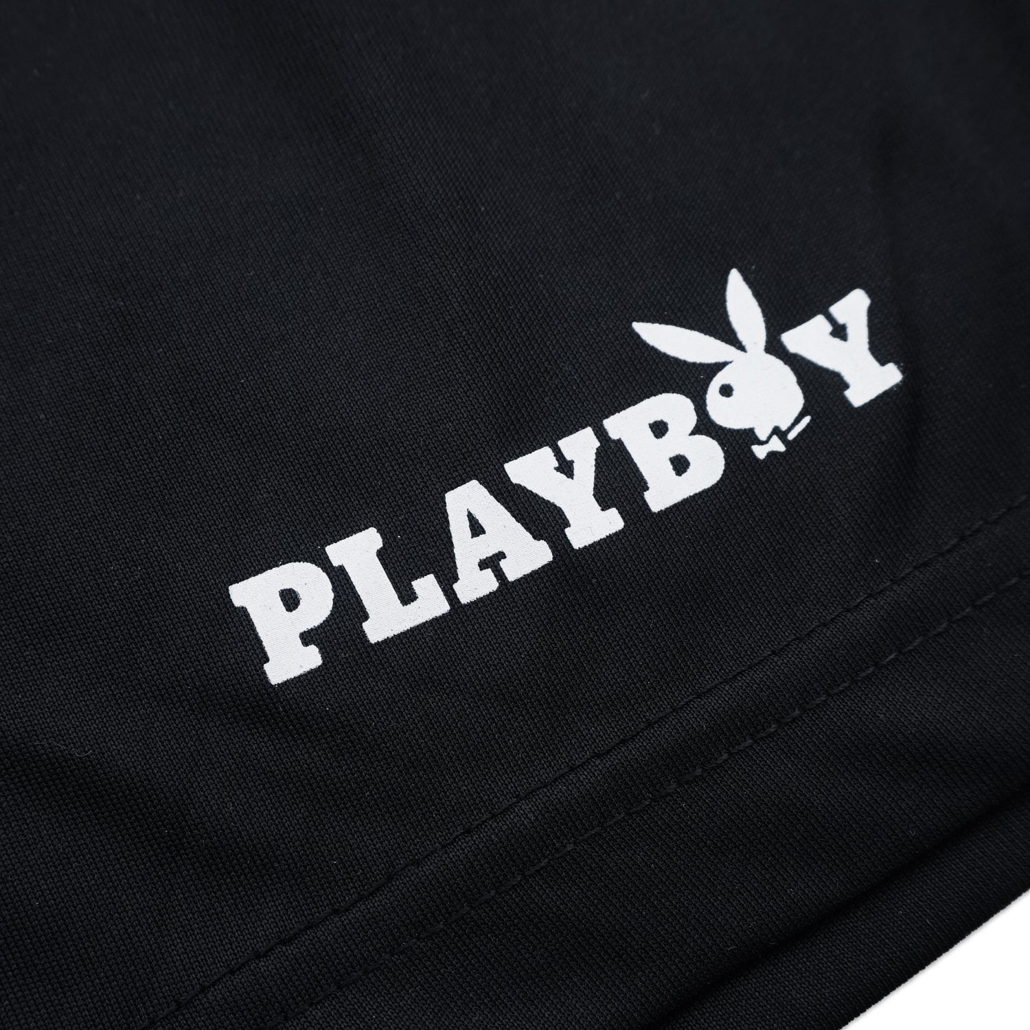 Black shorts with white 'PLAYBOY' logo featuring a rabbit emblem.