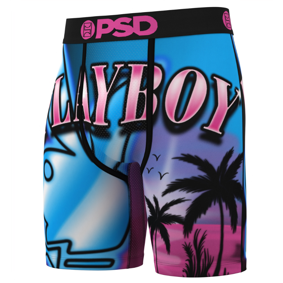 Layboy branded shorts with a colorful design featuring a beach scene and palm trees.