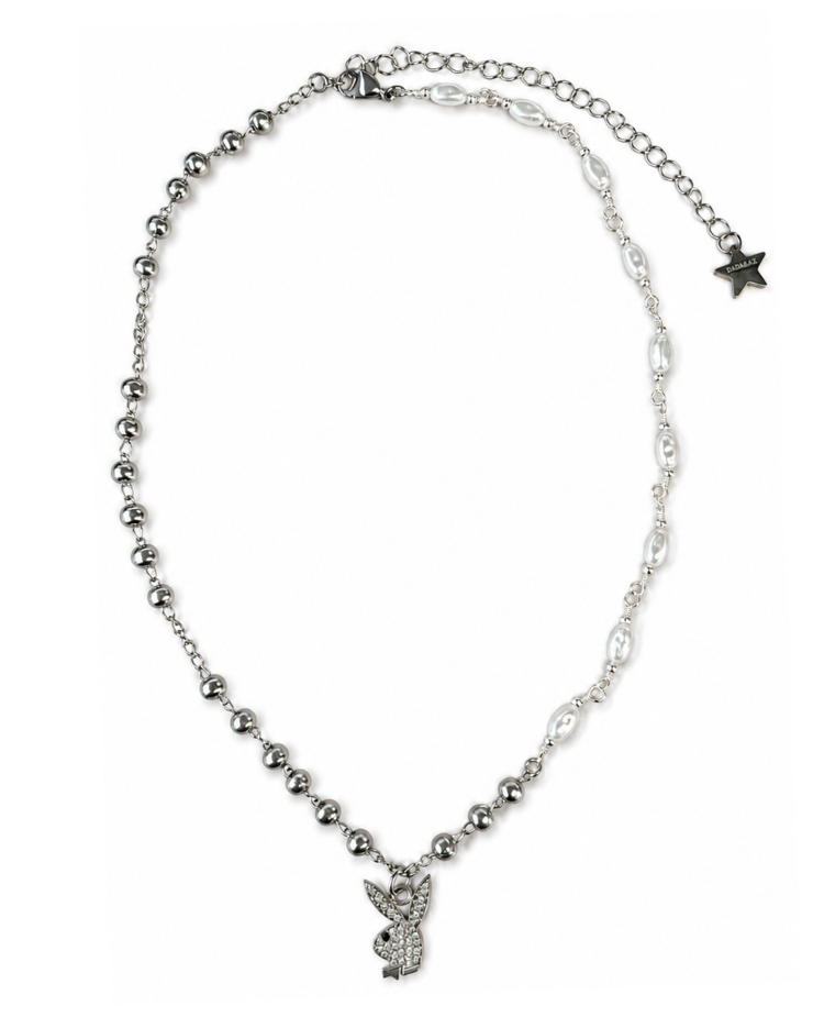 Silver necklace with a small pendant on a white background