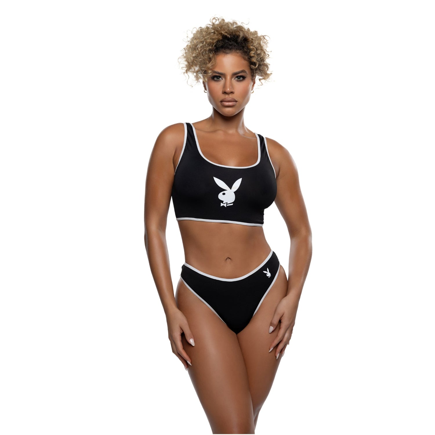 Woman wearing black two-piece sporty lounge set with white bunny logo and trim