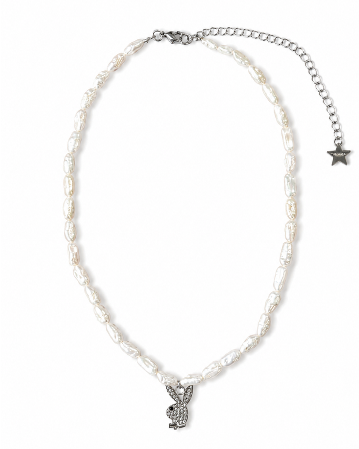 Pearl necklace with a silver charm on a white background
