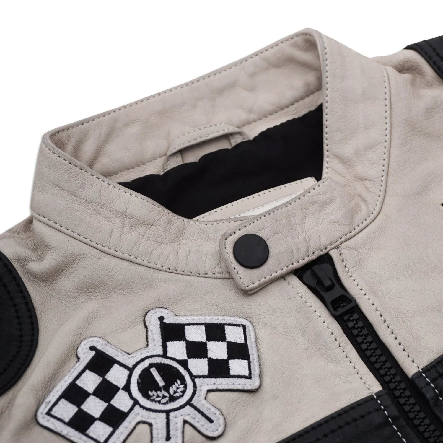Men's leather jacket with snap collar, zipper front, and black and white checkered patch.