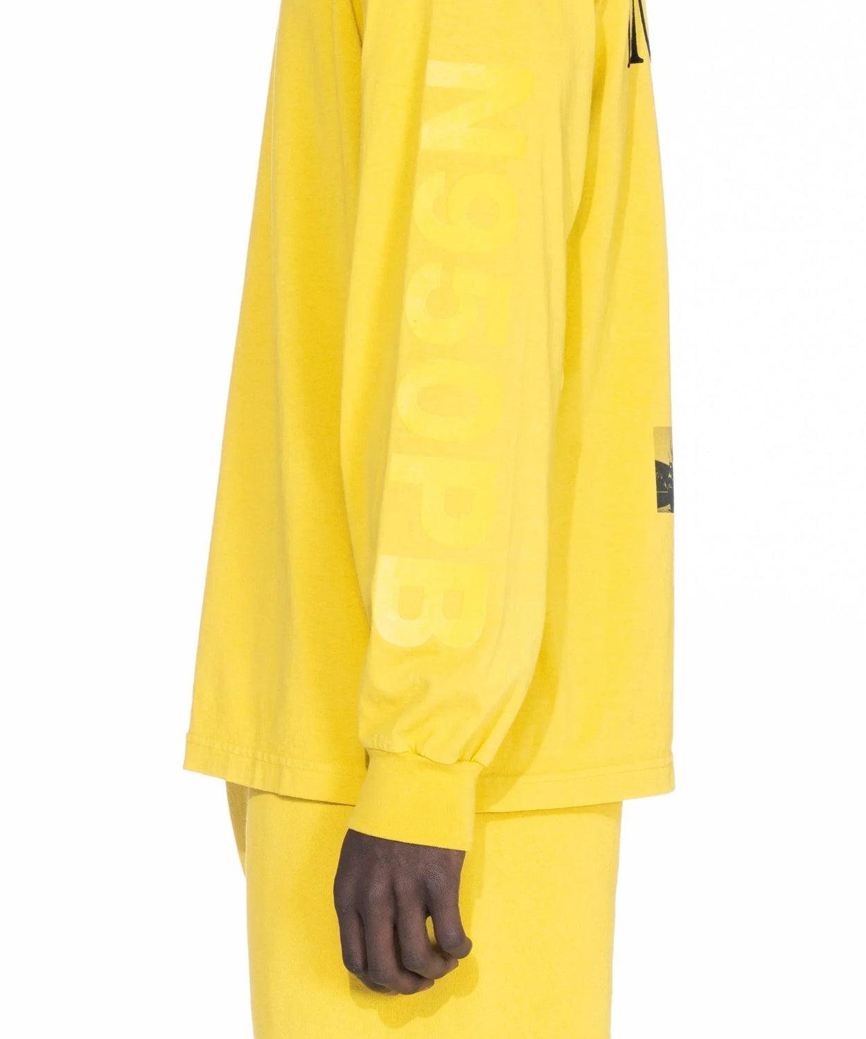 Yellow long sleeve T-shirt with N950PB text on sleeve, shown in side profile view.
