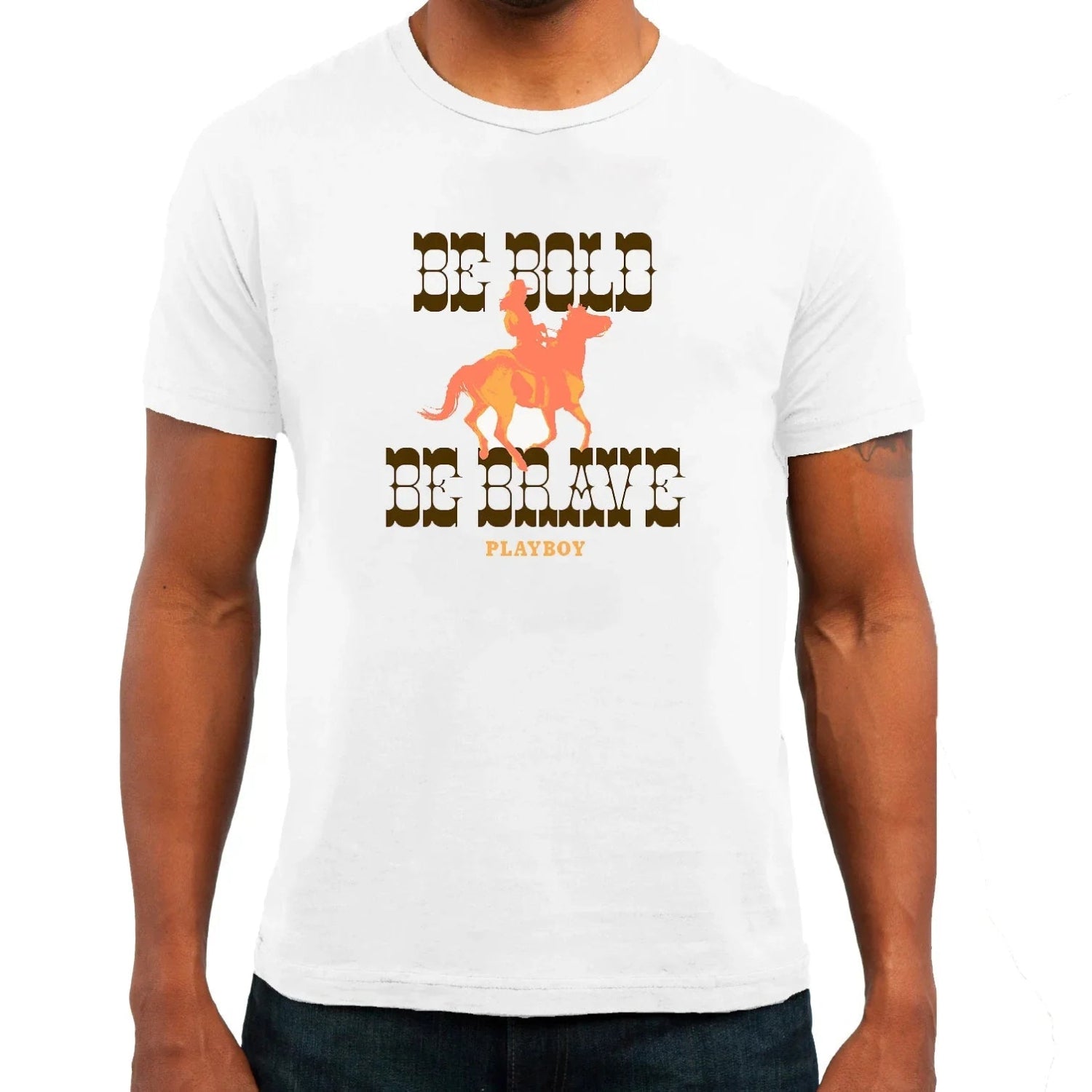 White graphic tee with cowboy and horse, bold western text 'Be Bold Be Brave' on front.