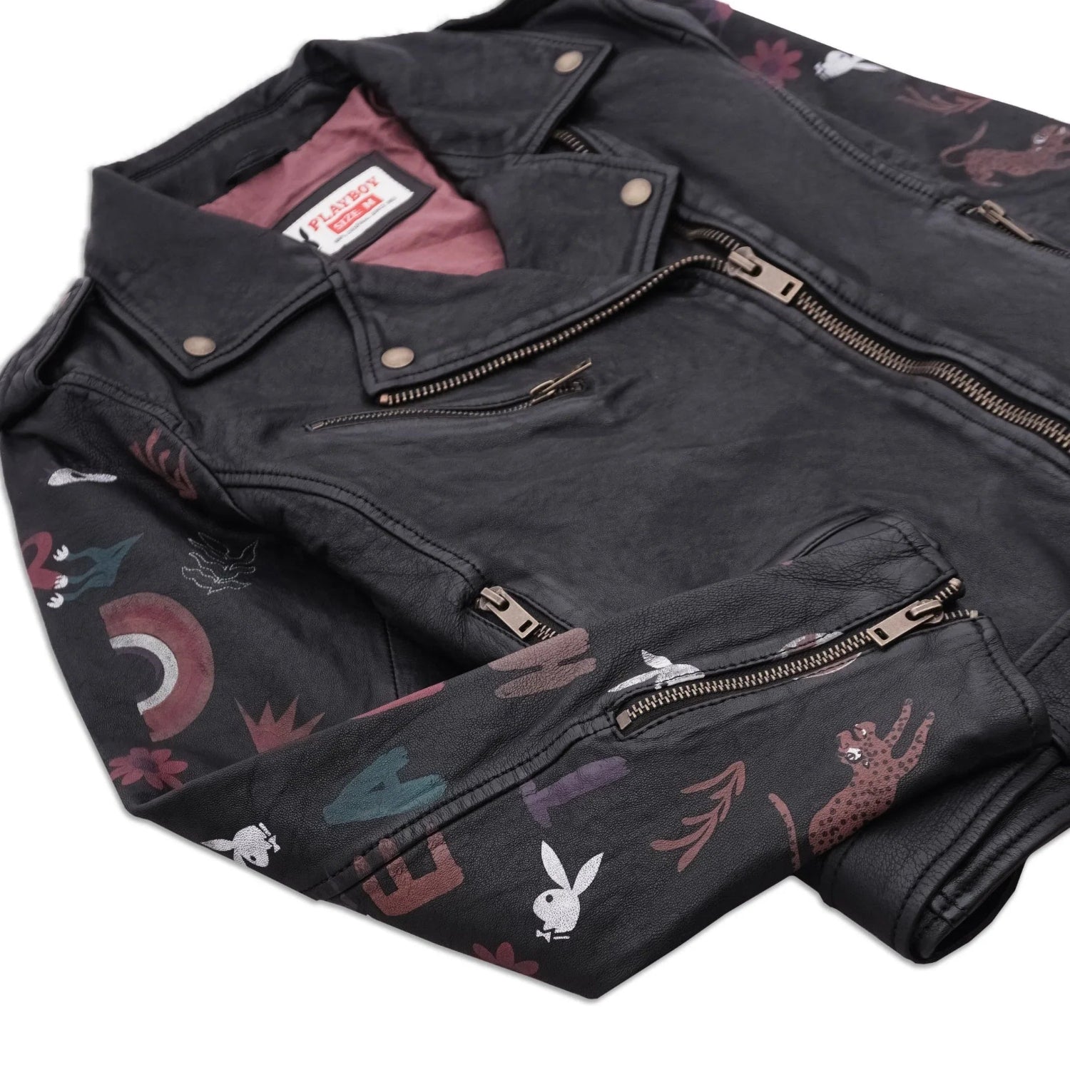 Women's black leather jacket with colorful graphics and embroidered patches on sleeves, front zipper pockets