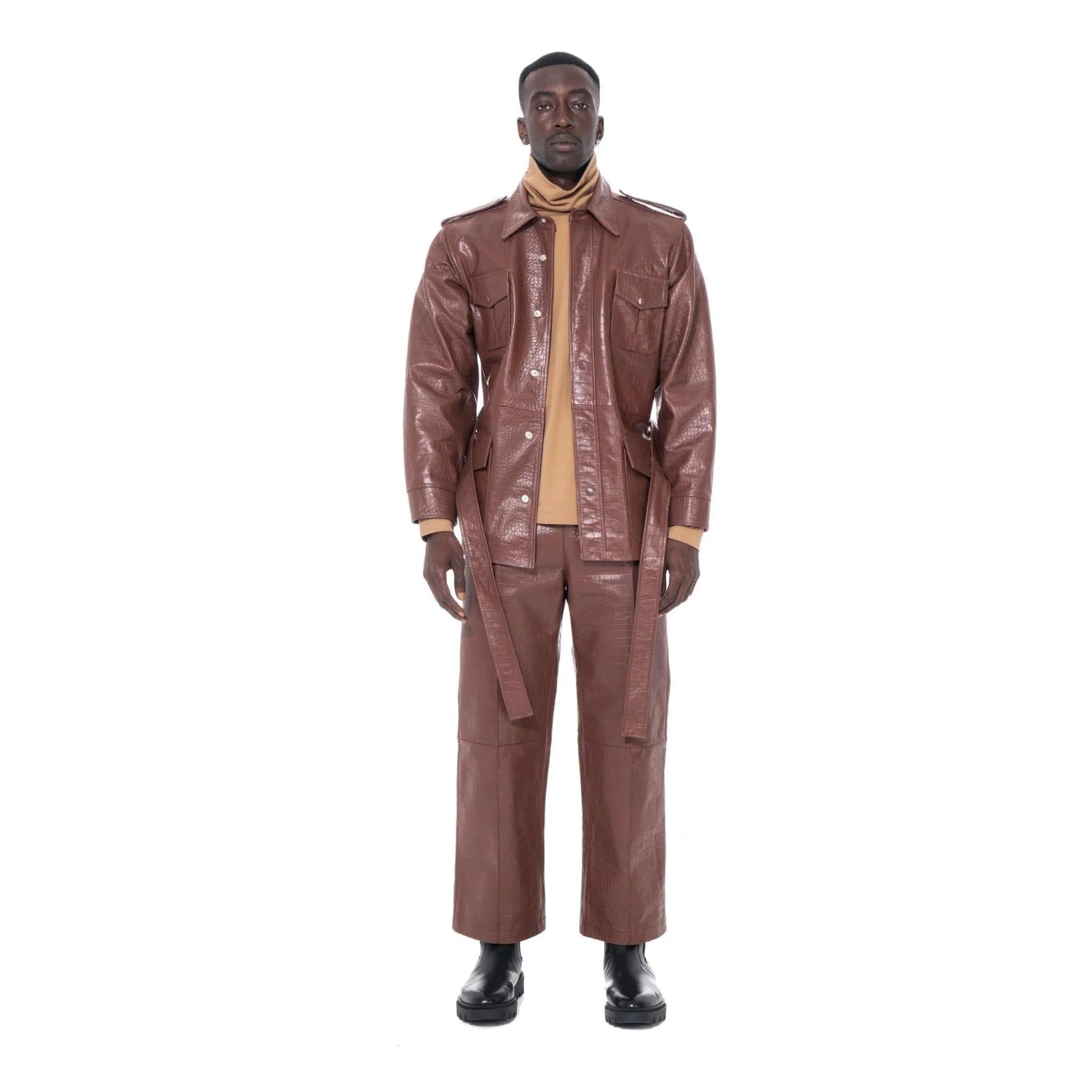 Man wearing brown crocodile-embossed leather safari jacket and matching pants, front view