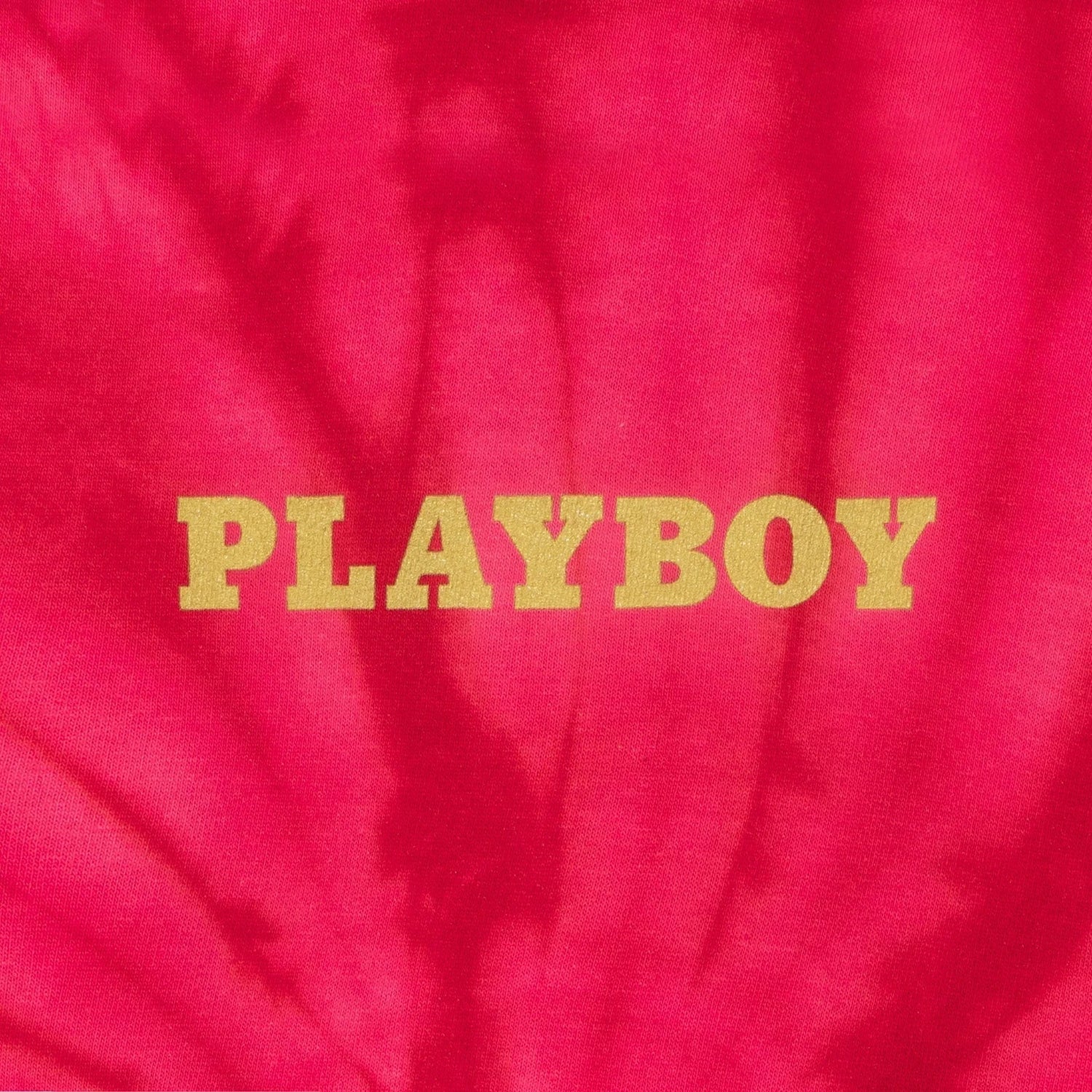 Pink tie-dye hoodie with yellow PLAYBOY logo on the front
