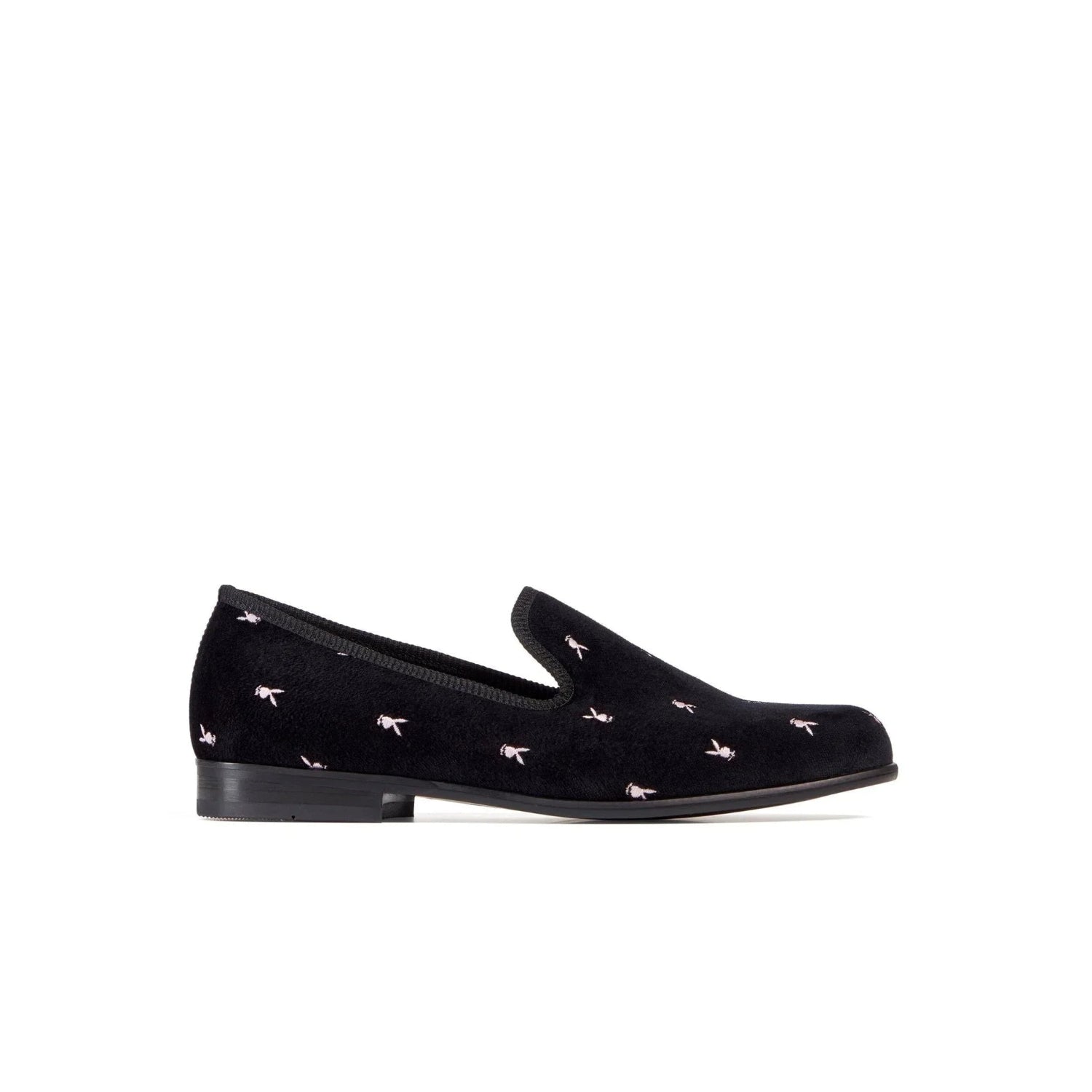 Black velvet loafer with small embroidered rabbit head motifs, side view on white background.