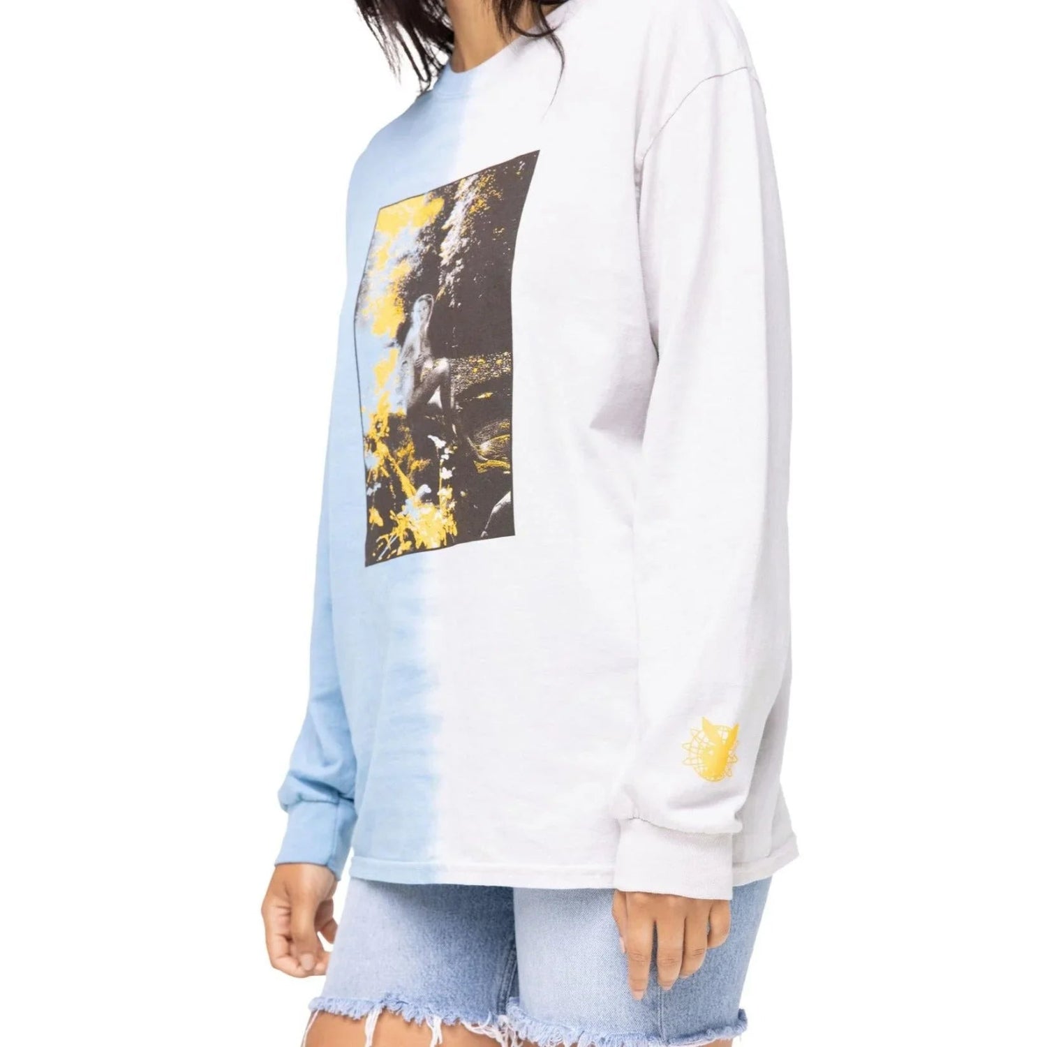 Woman wearing dip-dye long sleeve graphic tee with photo print and denim shorts