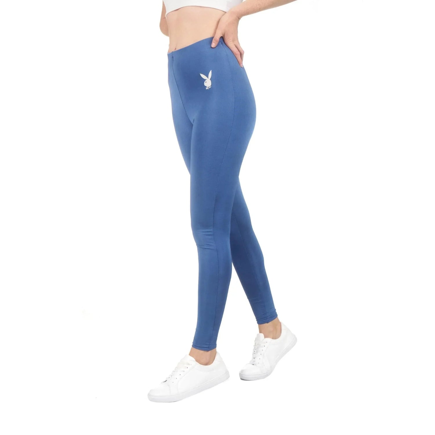 Woman wearing blue high-waisted leggings with white bunny logo, casual activewear style