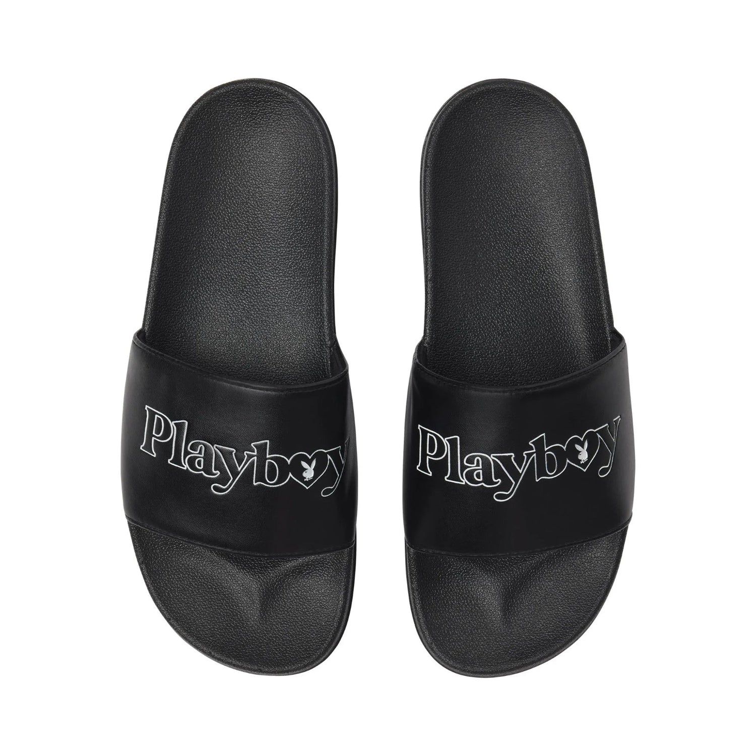 Black slide sandals with white Playboy logo on straps, shown on a white background.