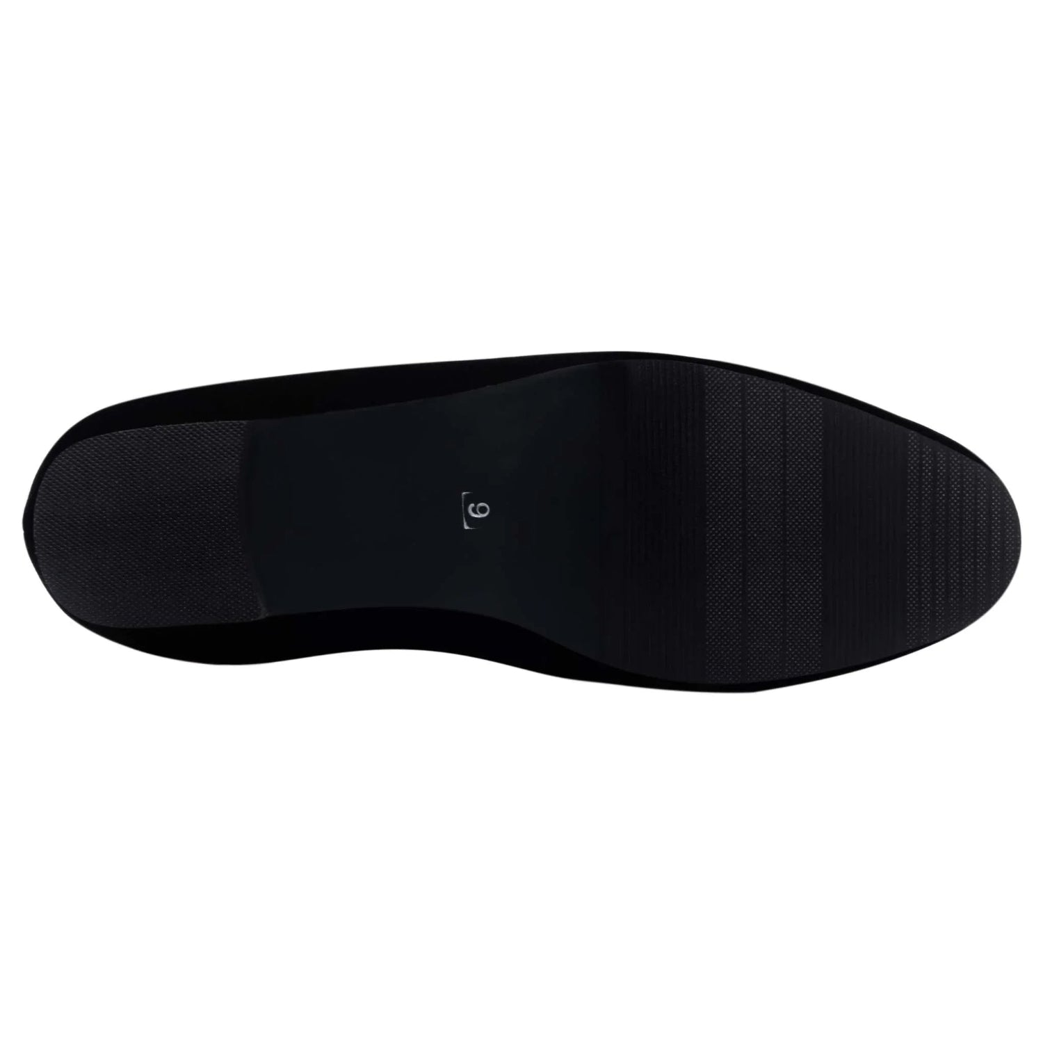 Bottom view of a men's loafer outsole, textured black sole, size 9.5 visible on arch.