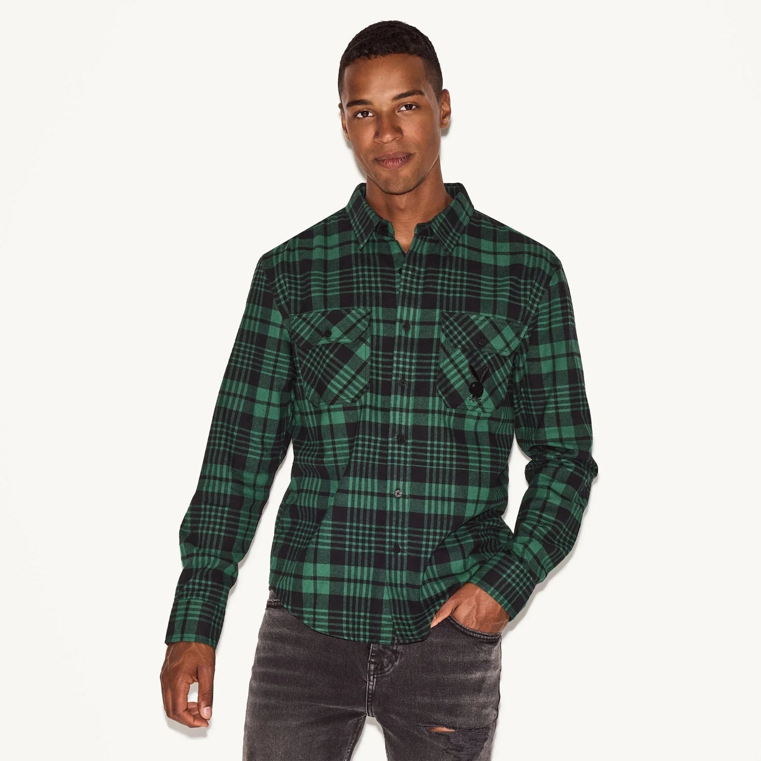 Man wearing green and black plaid flannel long sleeve shirt with chest pockets