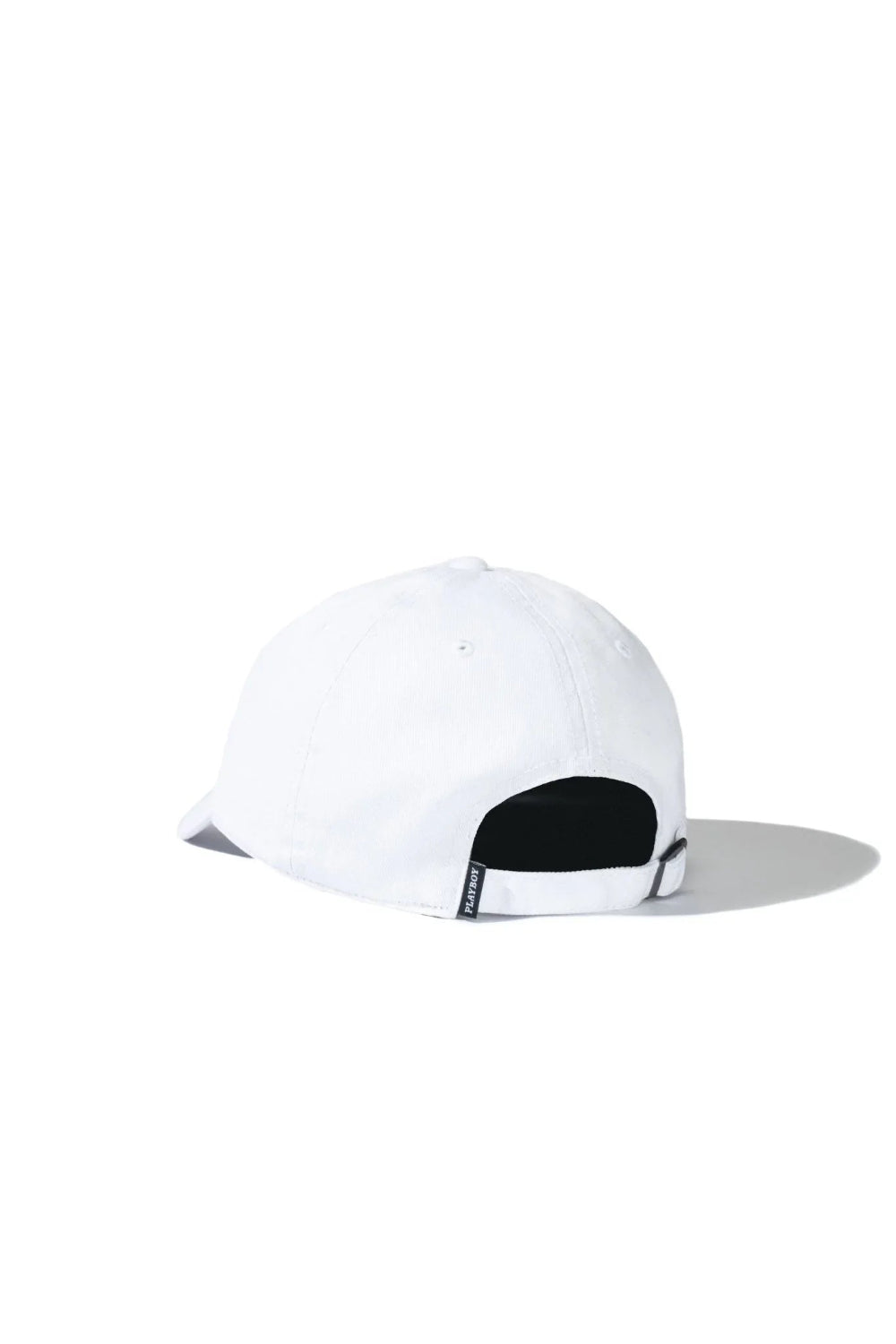 Back view of white dad hat with adjustable strap and small side tag on plain background