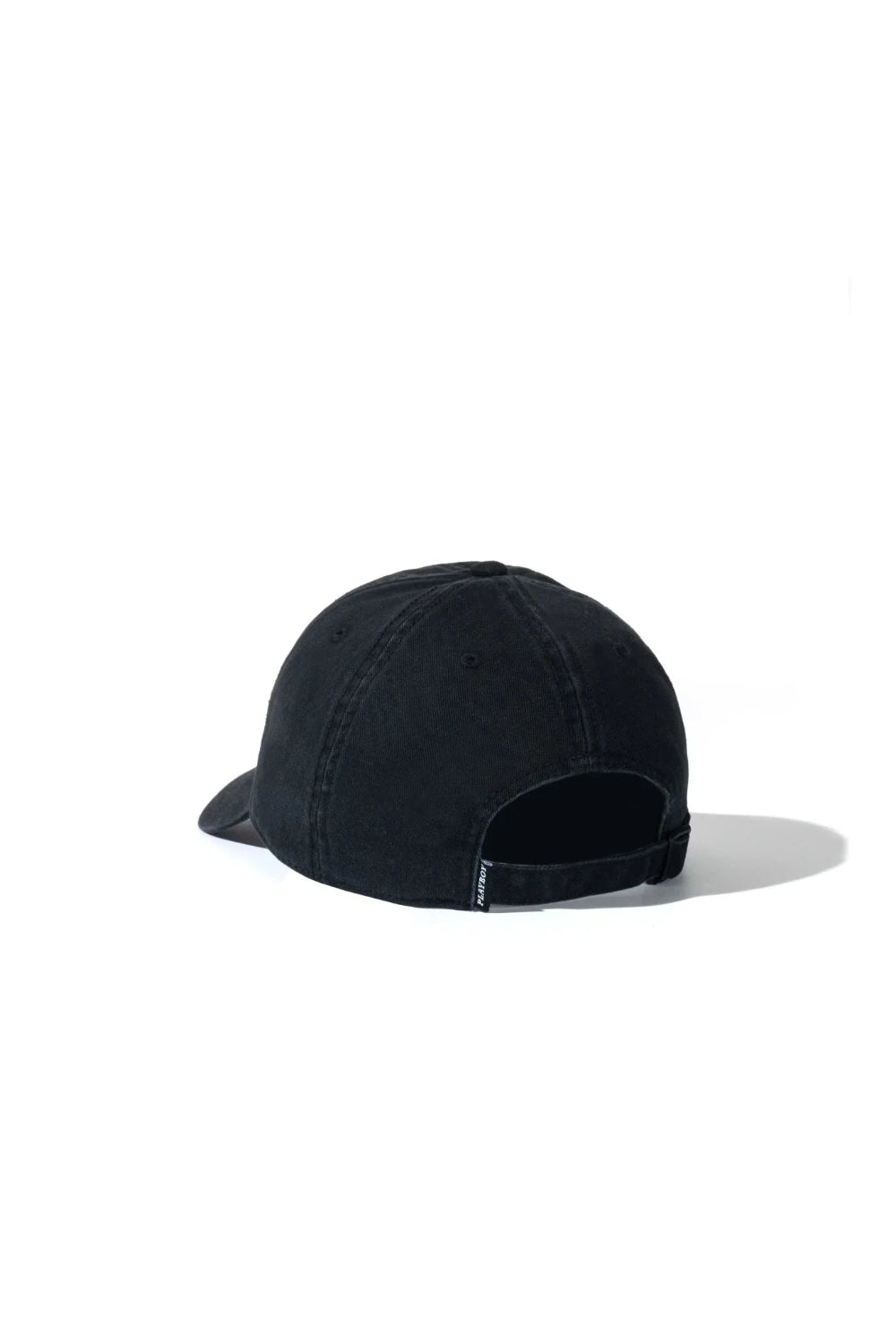 Rear view of a black dad hat with adjustable strap and small woven tag detail.