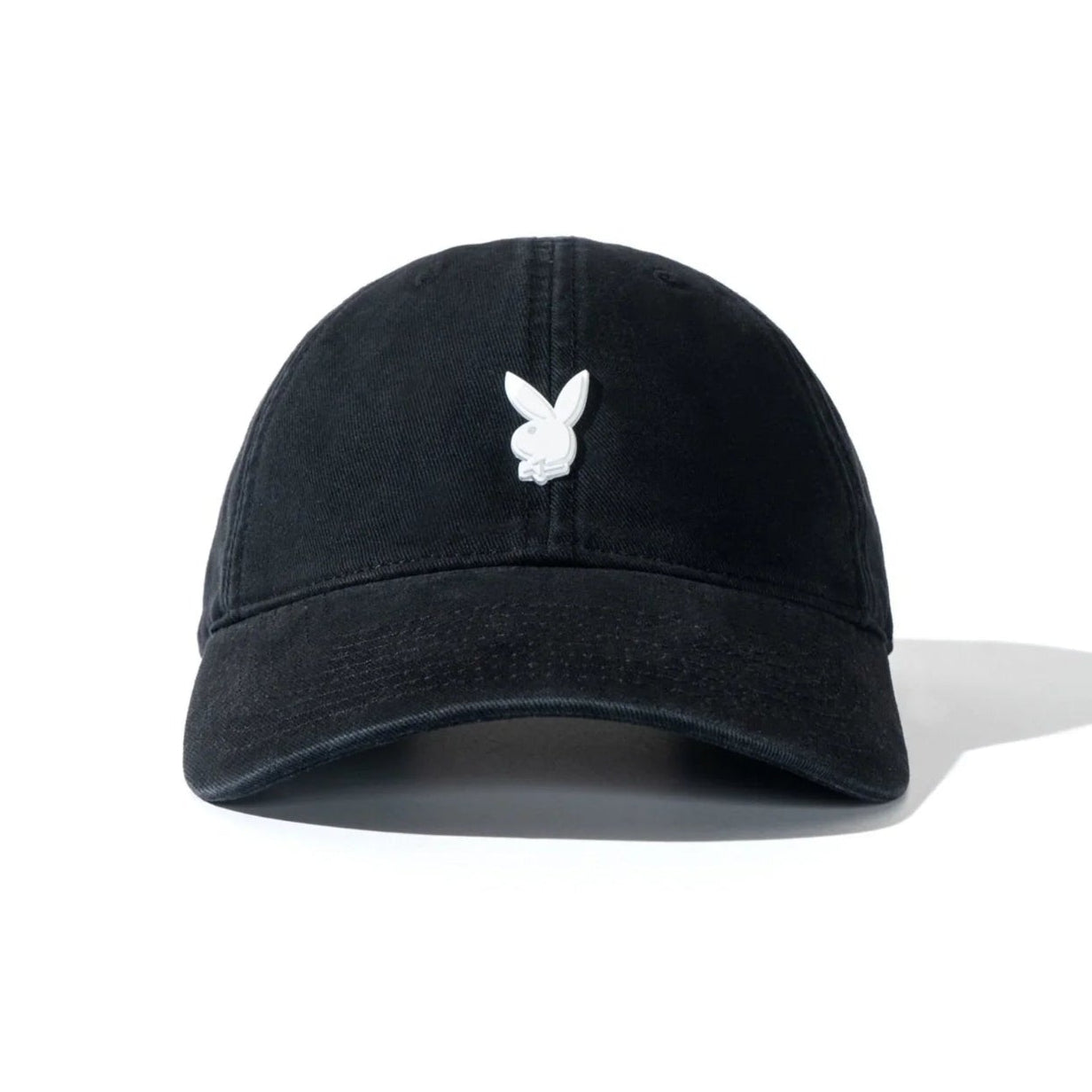 Black dad hat with metal rabbit head pin on front, minimalist streetwear accessory