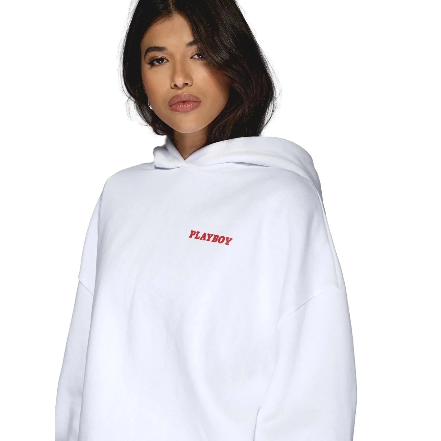 Woman wearing a white hoodie with red Playboy logo on chest, isolated background